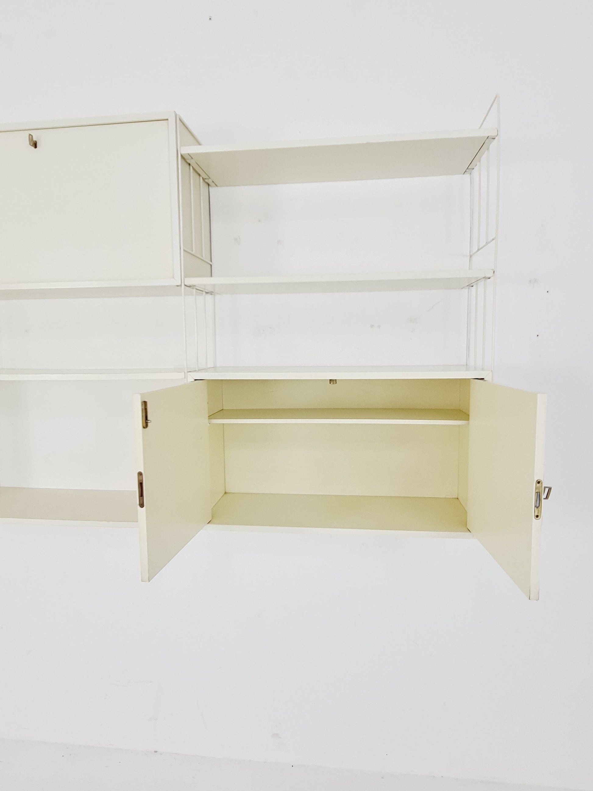 Wall-hanging String shelf-system, bookcase with bar cabinetby WHB Germany, 1950s