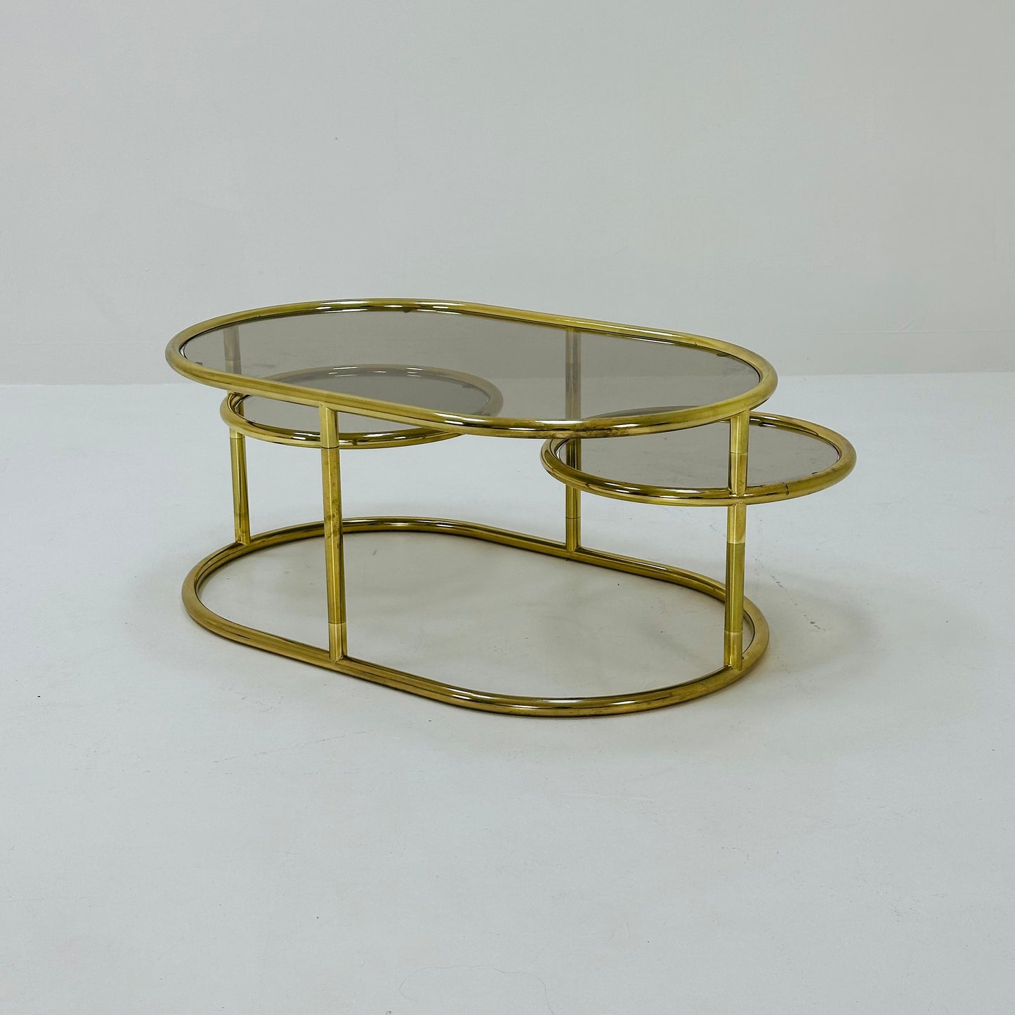 Mid century swivel coffee table brass & smoked glass ,by Milo Baughman, 1970s Italy 