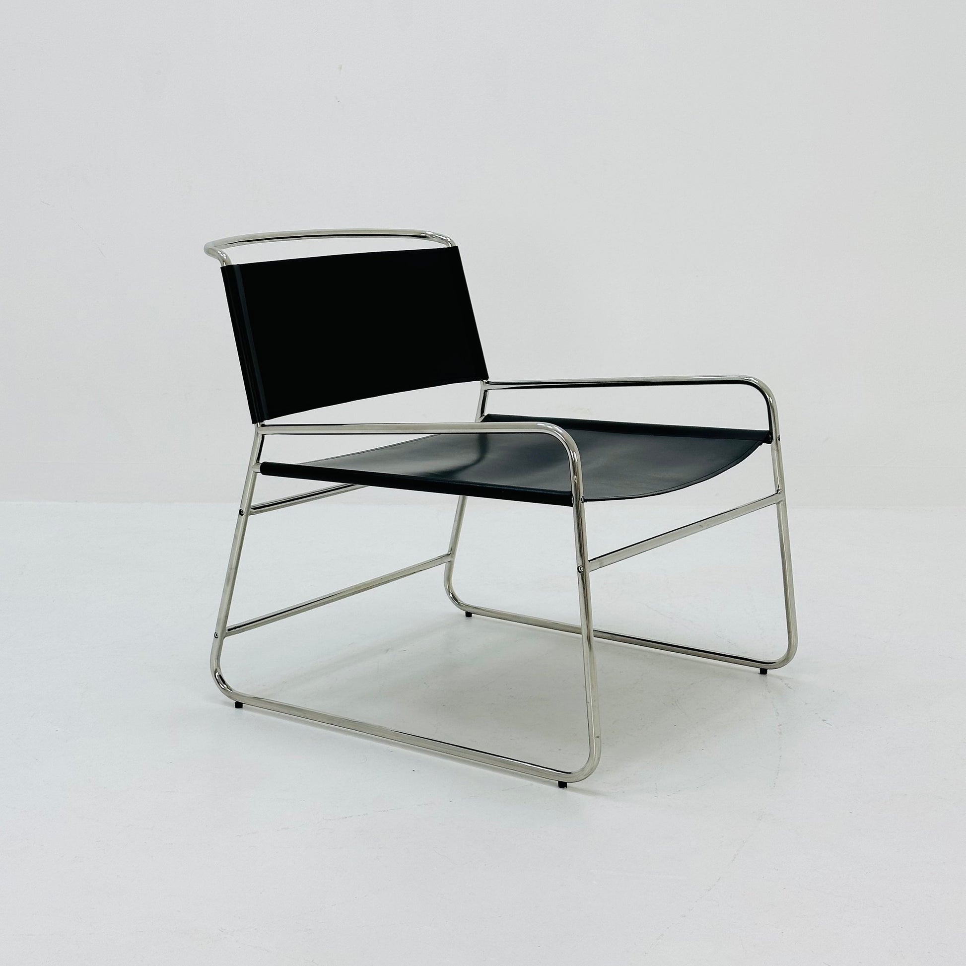 Mid century black leather lounge chair in Bauhaus style .