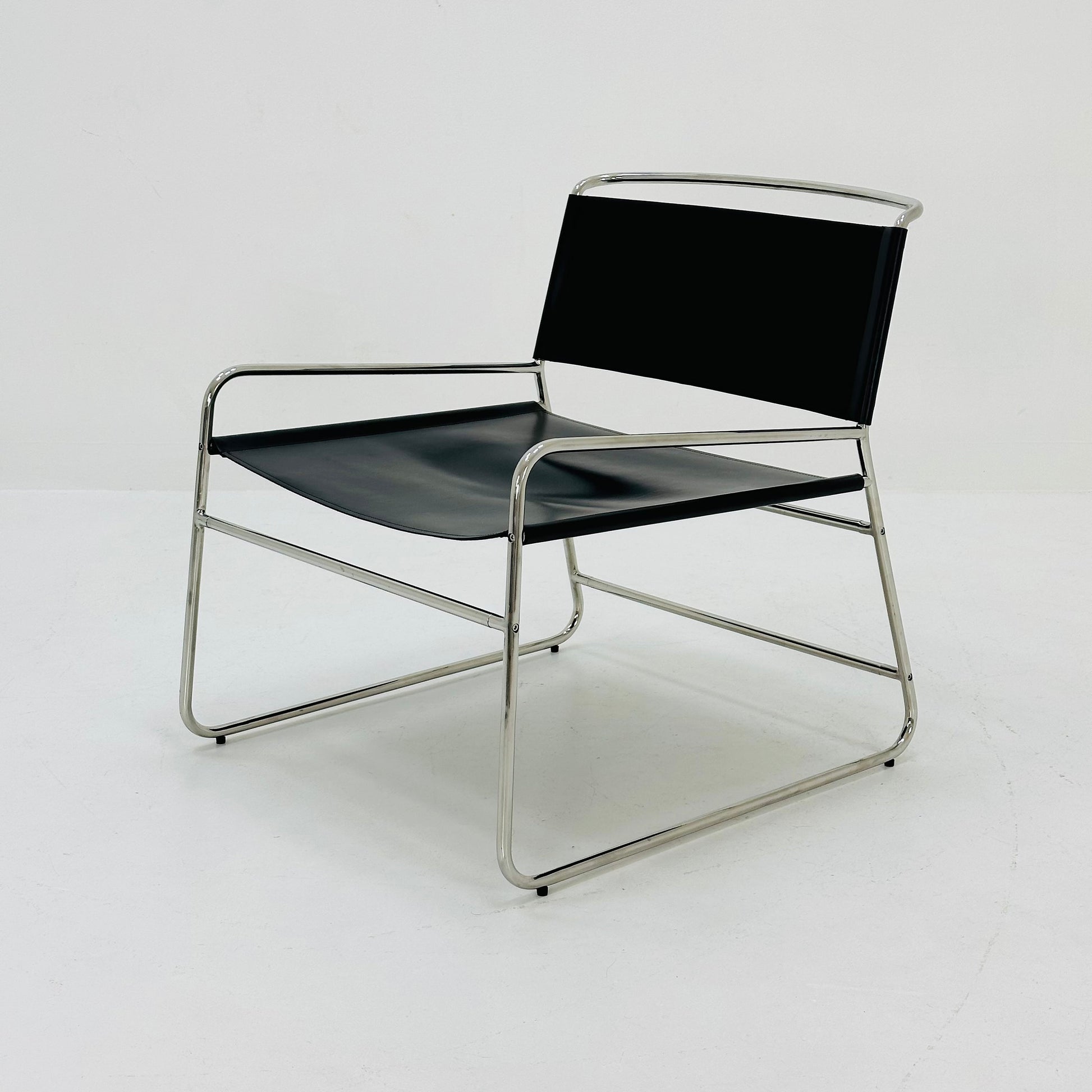 Mid century black leather lounge chair in Bauhaus style .