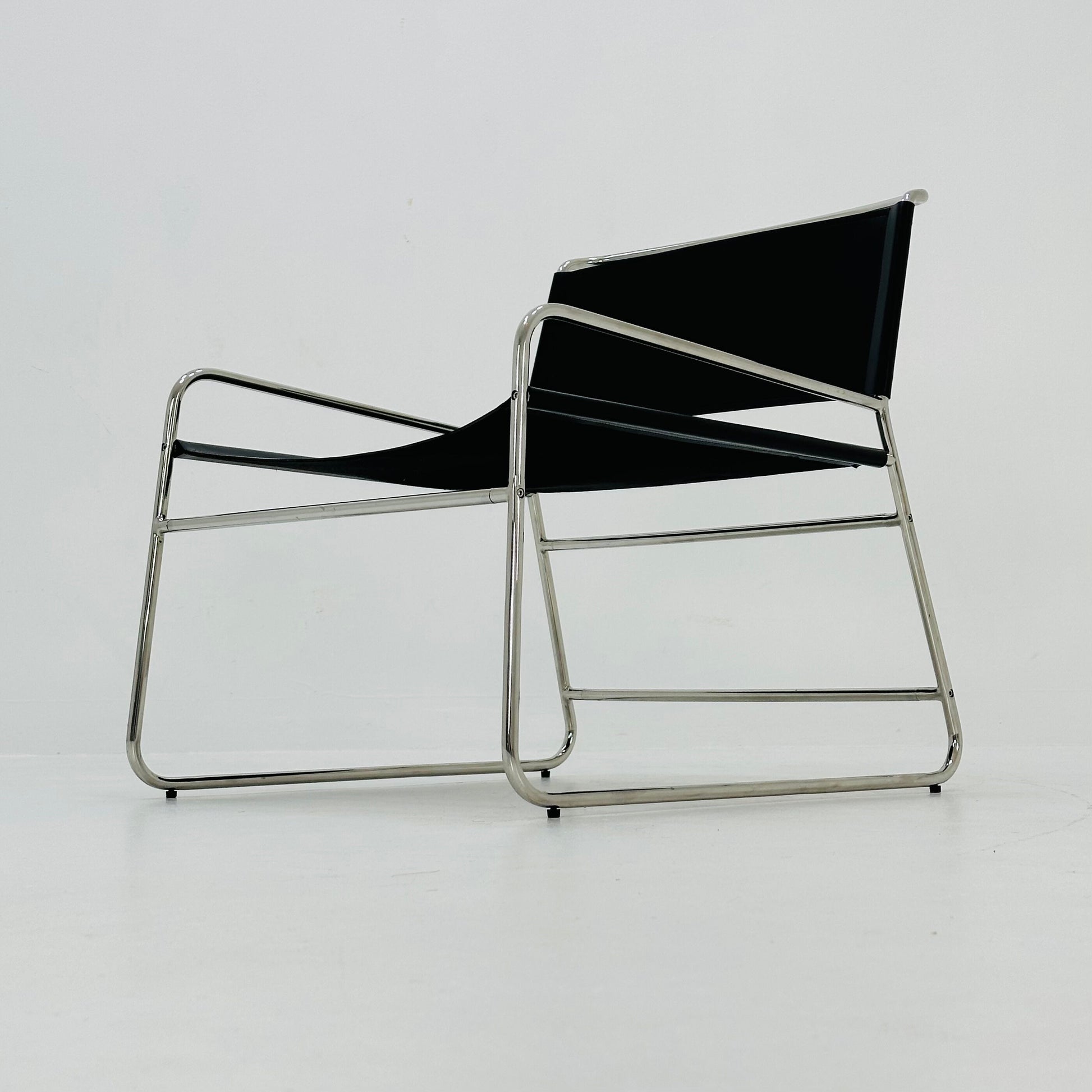 Mid century black leather lounge chair in Bauhaus style .