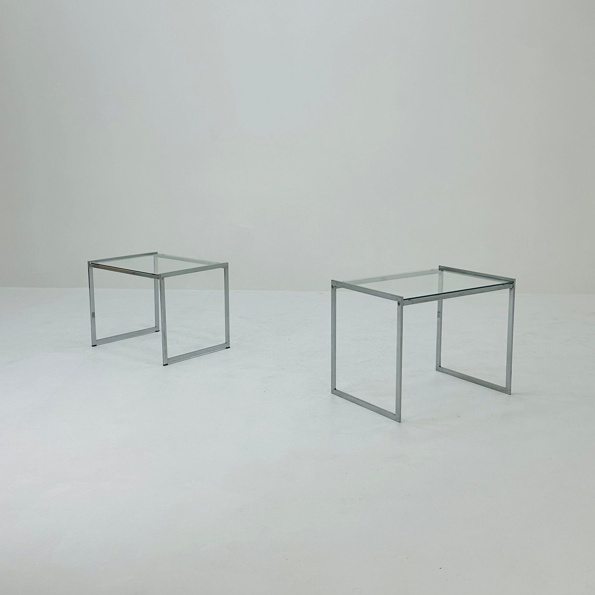 Set of tow Bauhaus side tables / bar tables in chrome and glass Italy 1970s