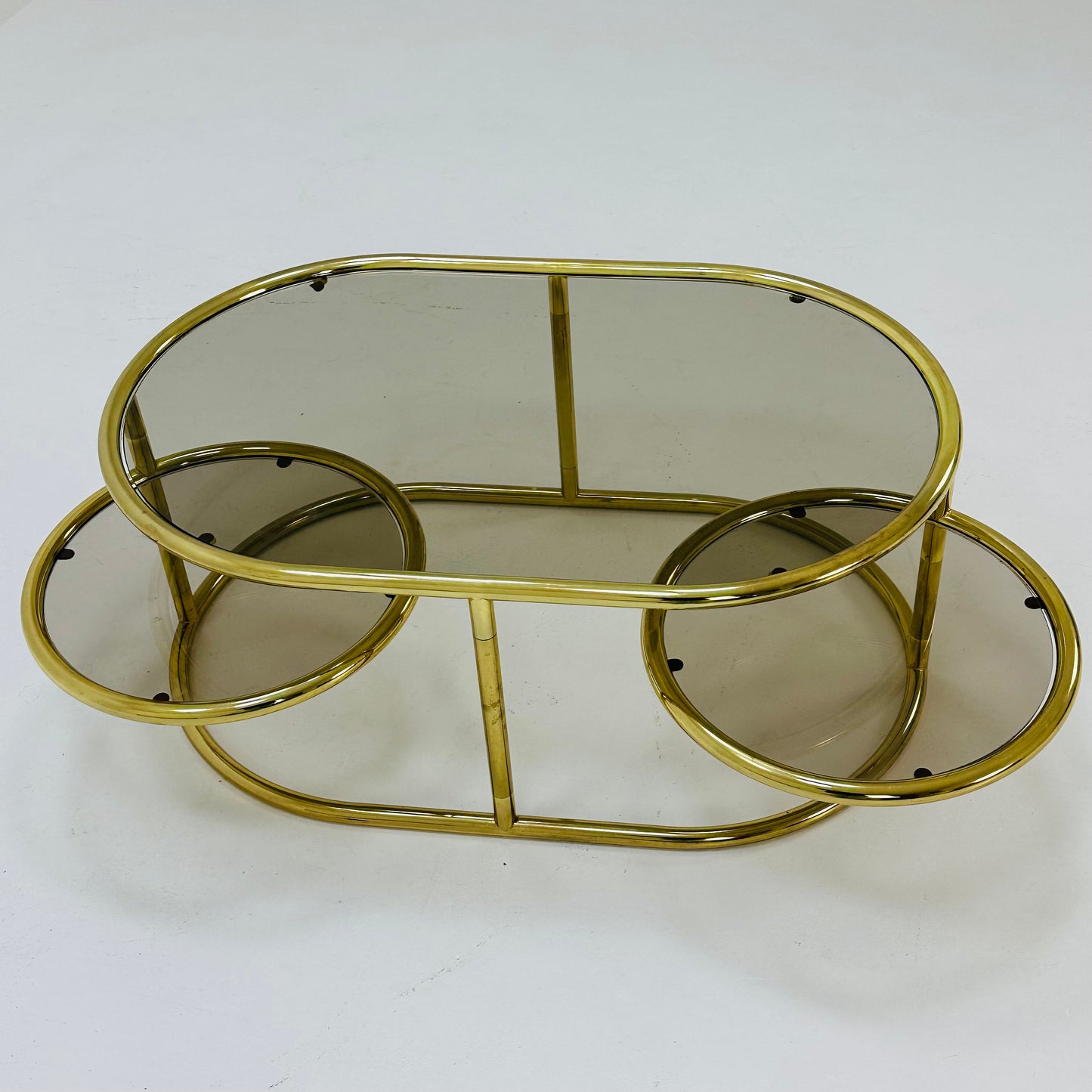 Mid century swivel coffee table brass & smoked glass ,by Milo Baughman, 1970s Italy 