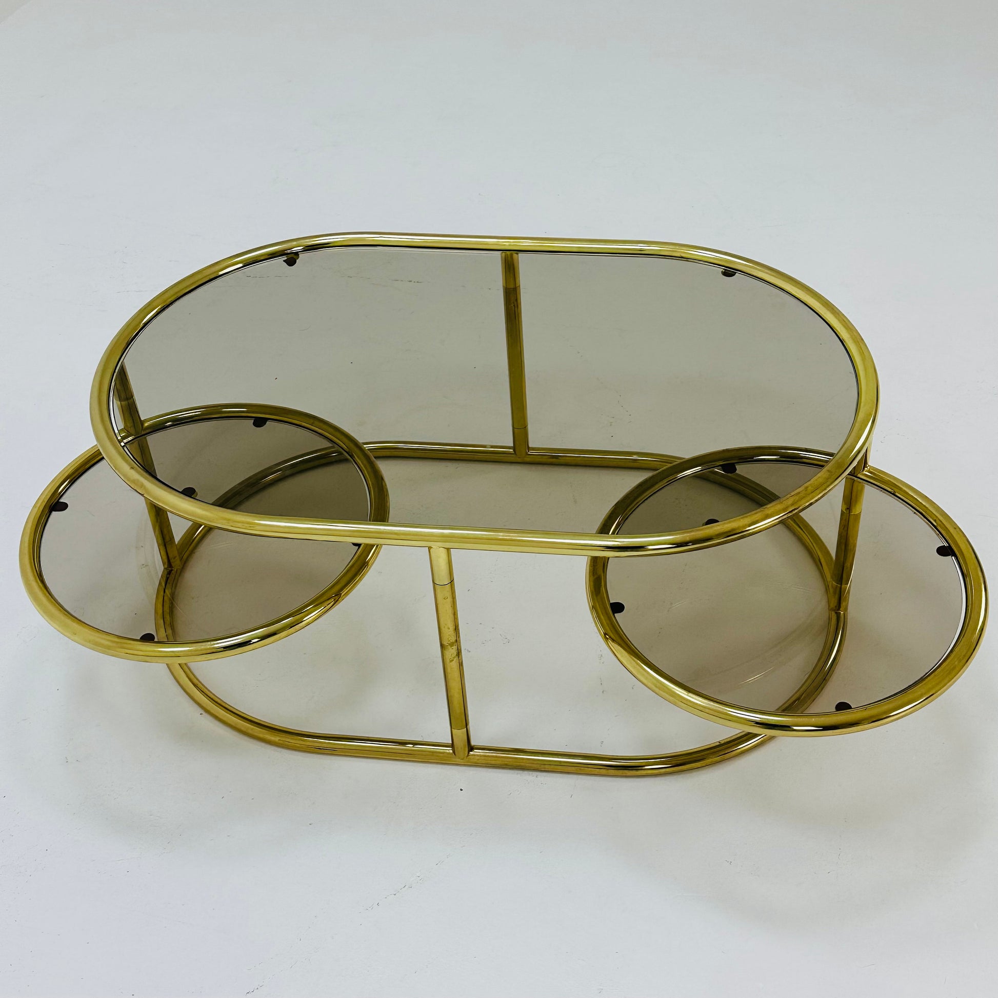 Mid century swivel coffee table brass & smoked glass ,by Milo Baughman, 1970s Italy 