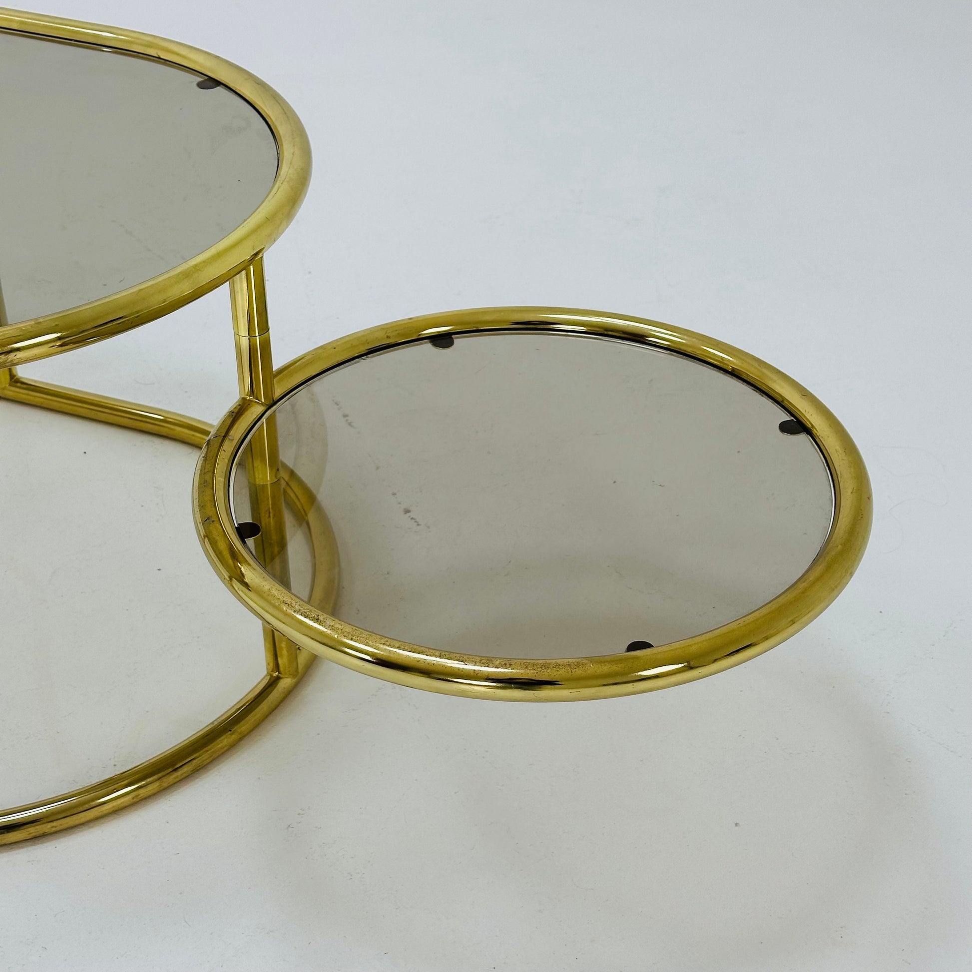 Mid century swivel coffee table brass & smoked glass ,by Milo Baughman, 1970s Italy 