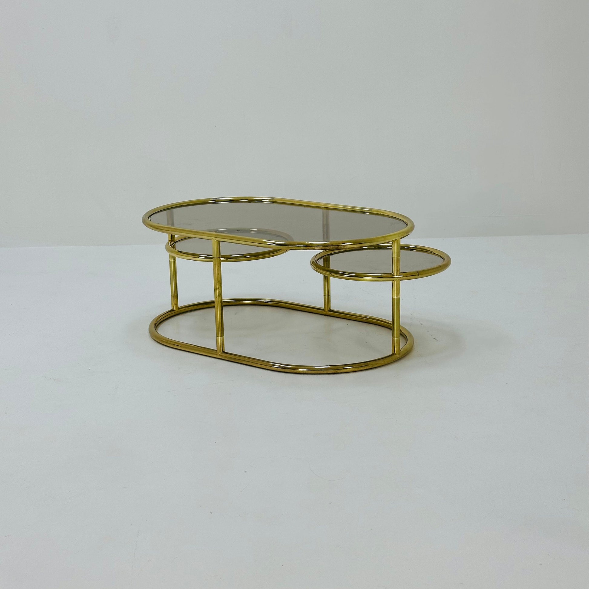 Mid century swivel coffee table brass & smoked glass ,by Milo Baughman, 1970s Italy 