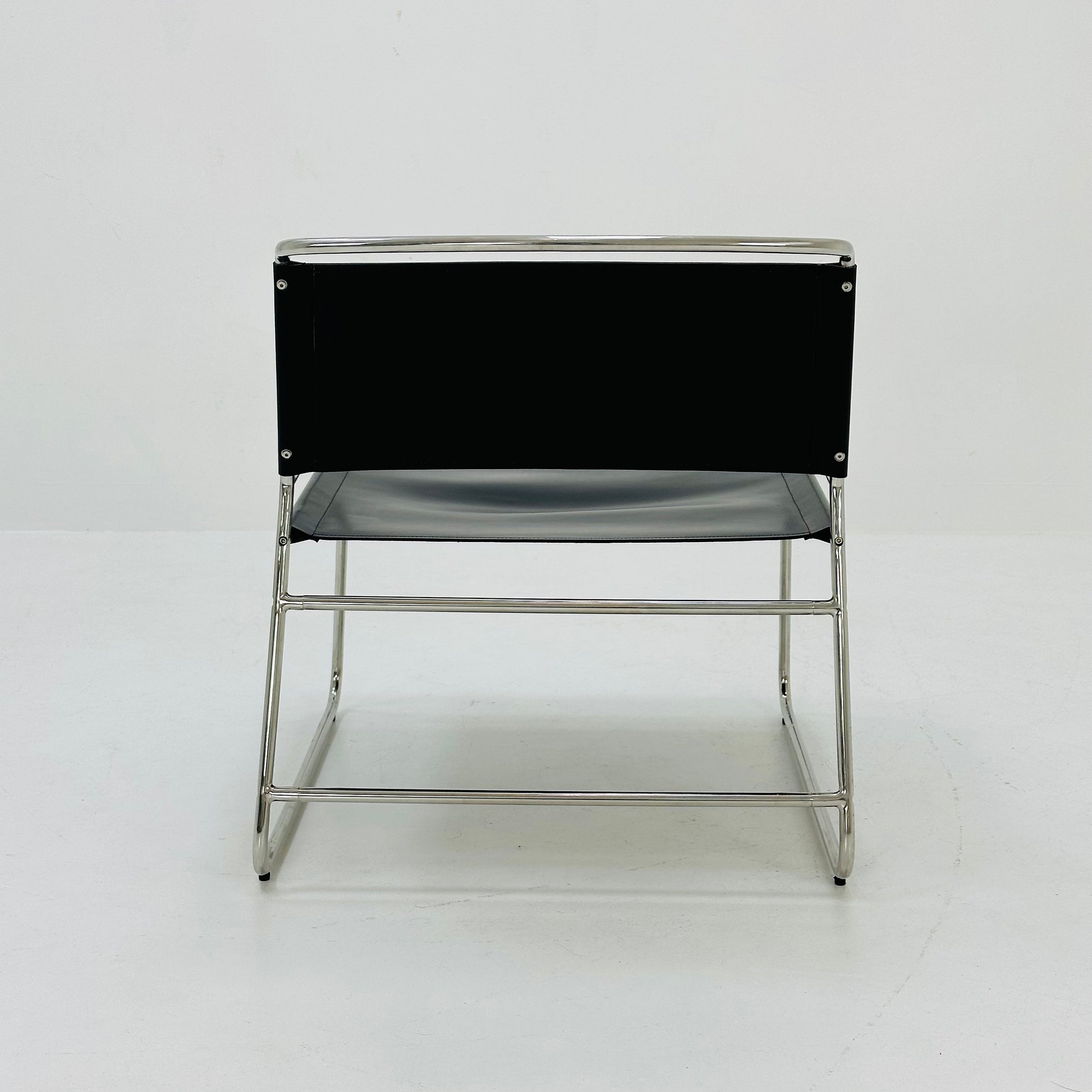 Mid century black leather lounge chair in Bauhaus style .
