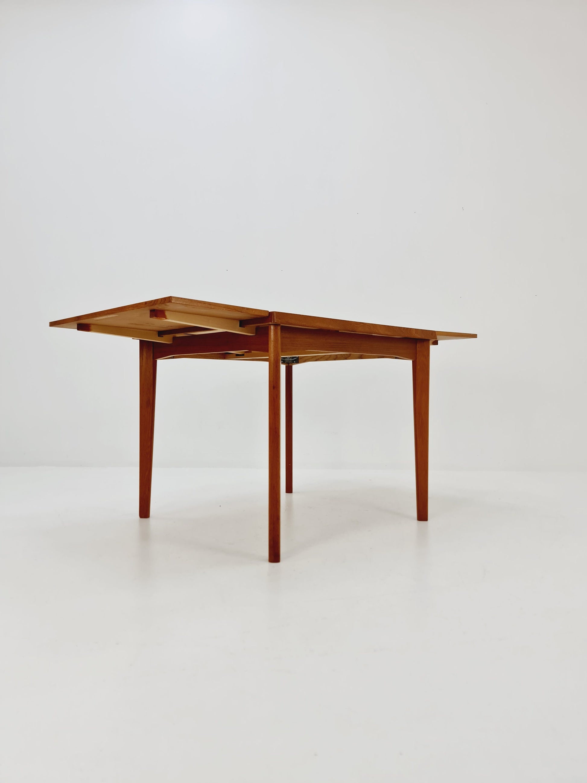 Danish Henning Kjaernulf rectangular teak table with two extension leaves, Denmark 1960s