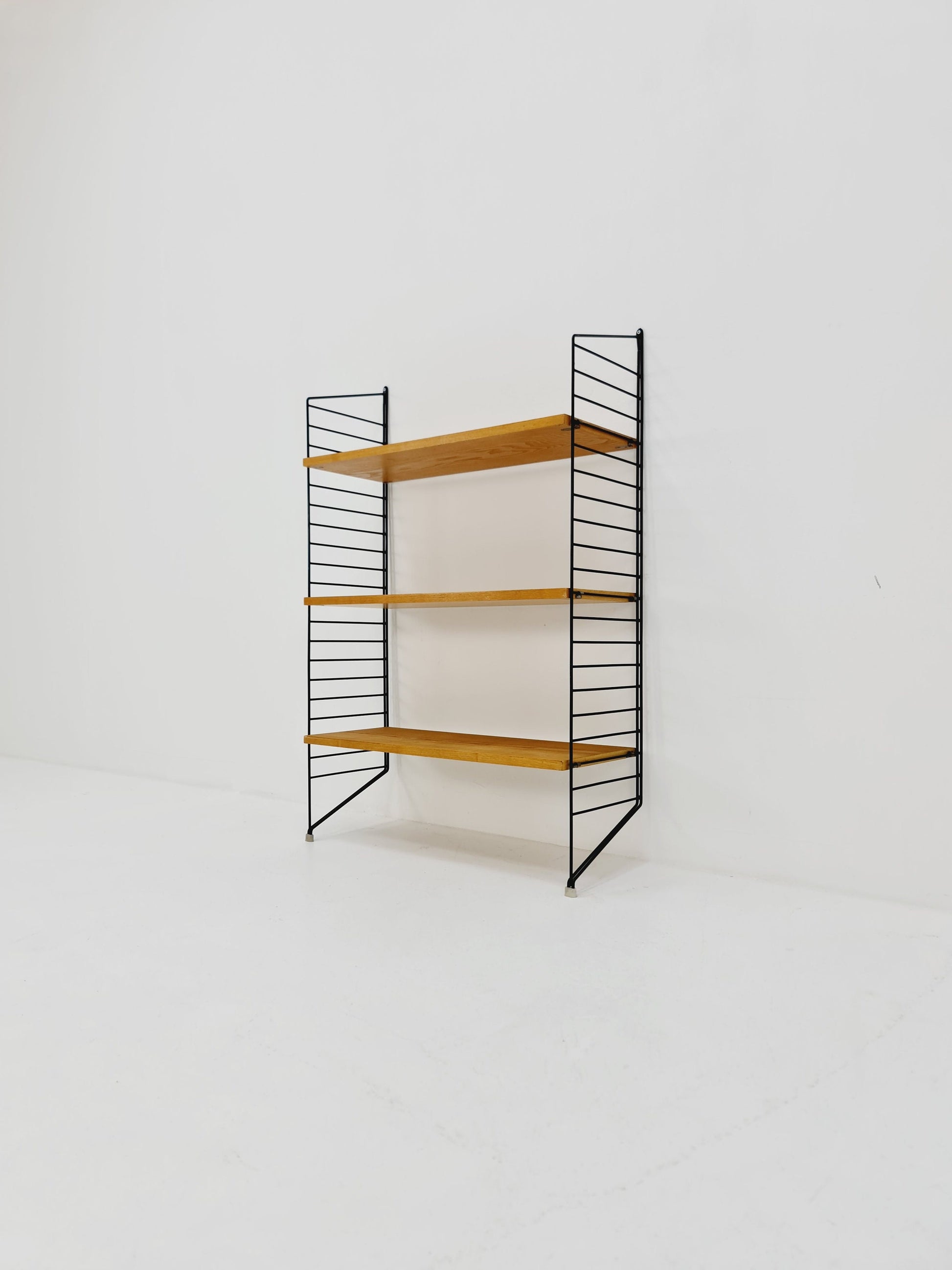 Original MCM Ash wood shelving system - consists of black lacquered metal ladders, from string Stockholm 1960s