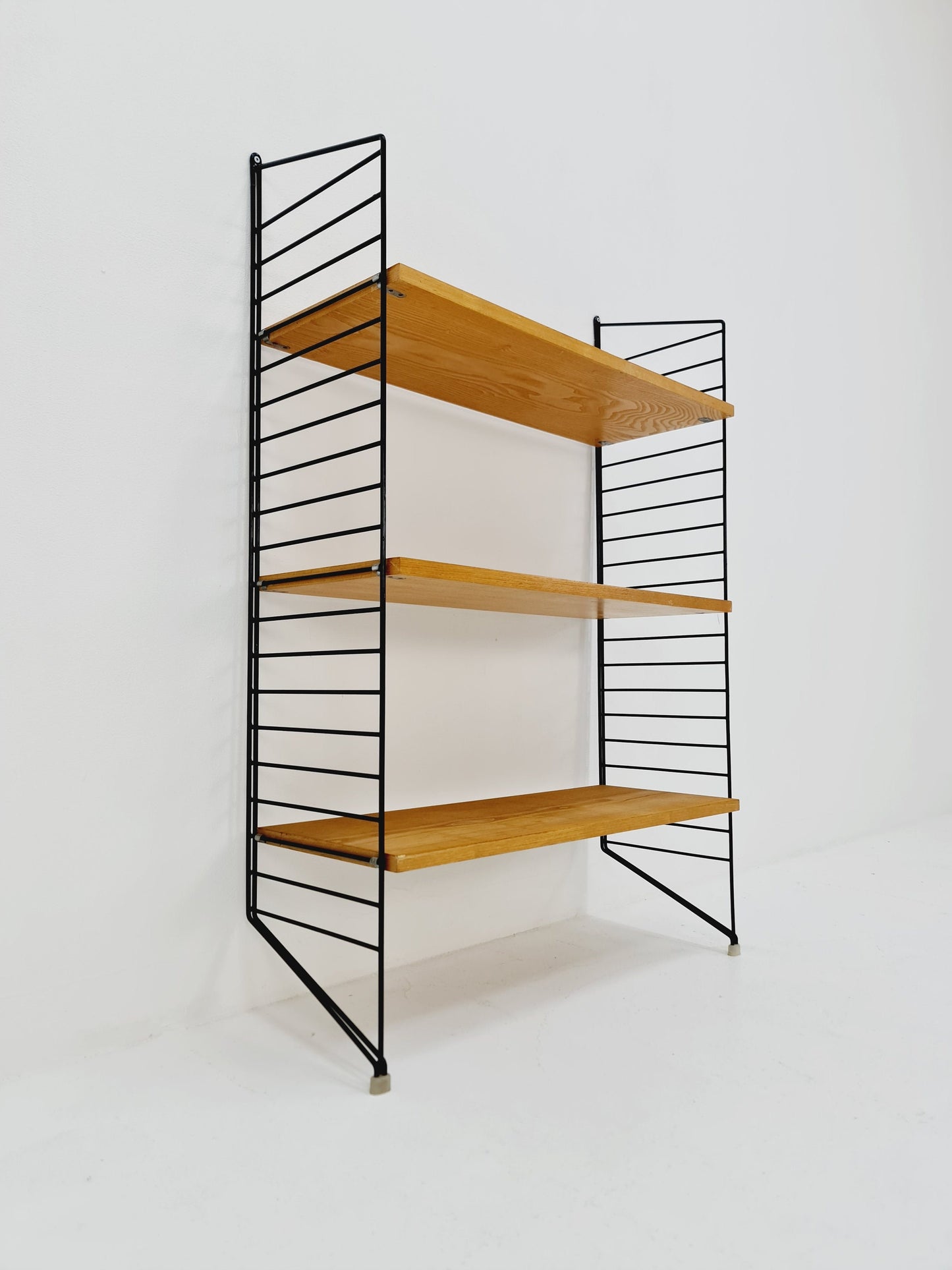 Original MCM Ash wood shelving system - consists of black lacquered metal ladders, from string Stockholm 1960s