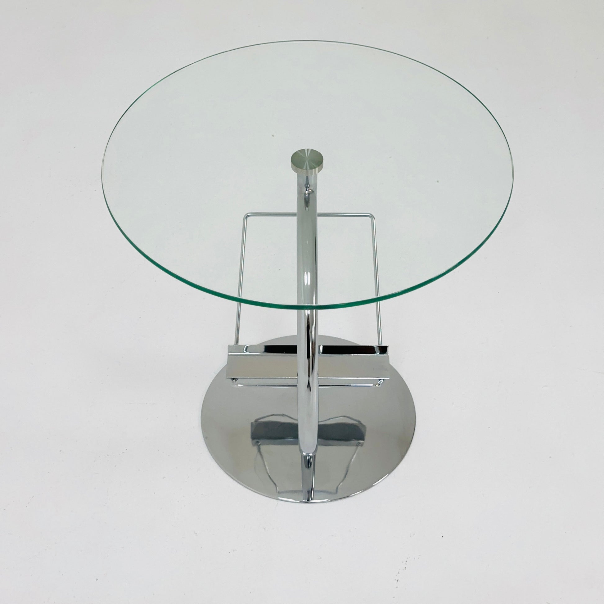 Mid century designer side table / magazine table. chrome and glass top, Italy
