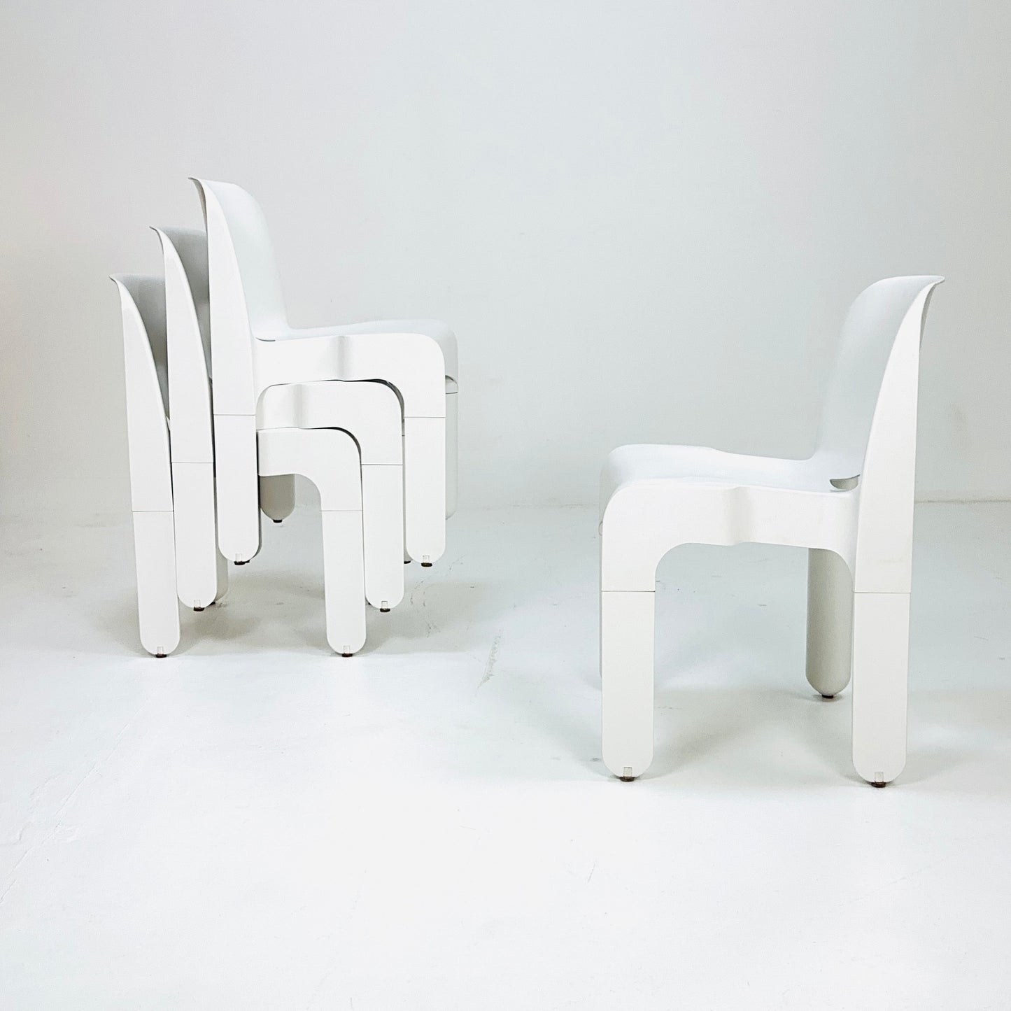 Set of 4 Space age Universale white chairs,designed by Joe Colombo for Kartell Italy 1960s