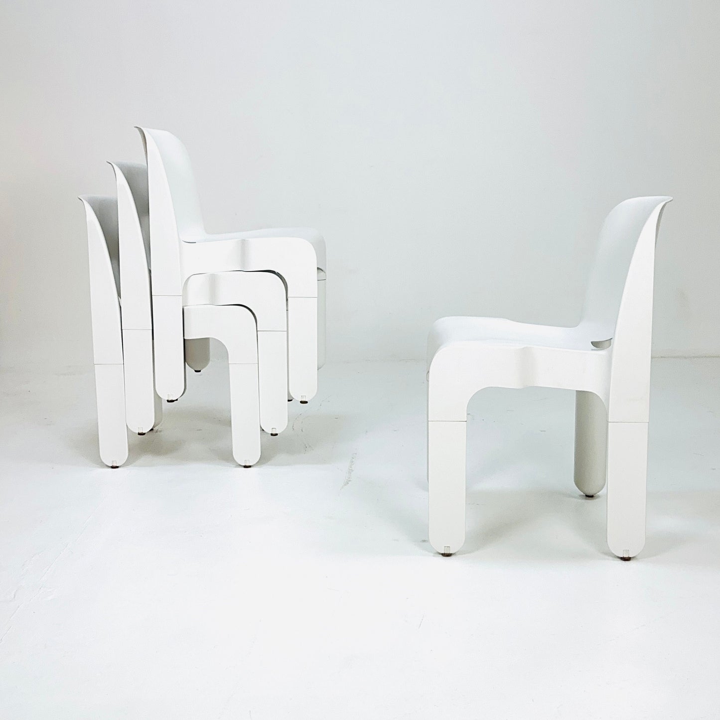 Set of 4 Space age Universale white chairs,designed by Joe Colombo for Kartell Italy 1960s