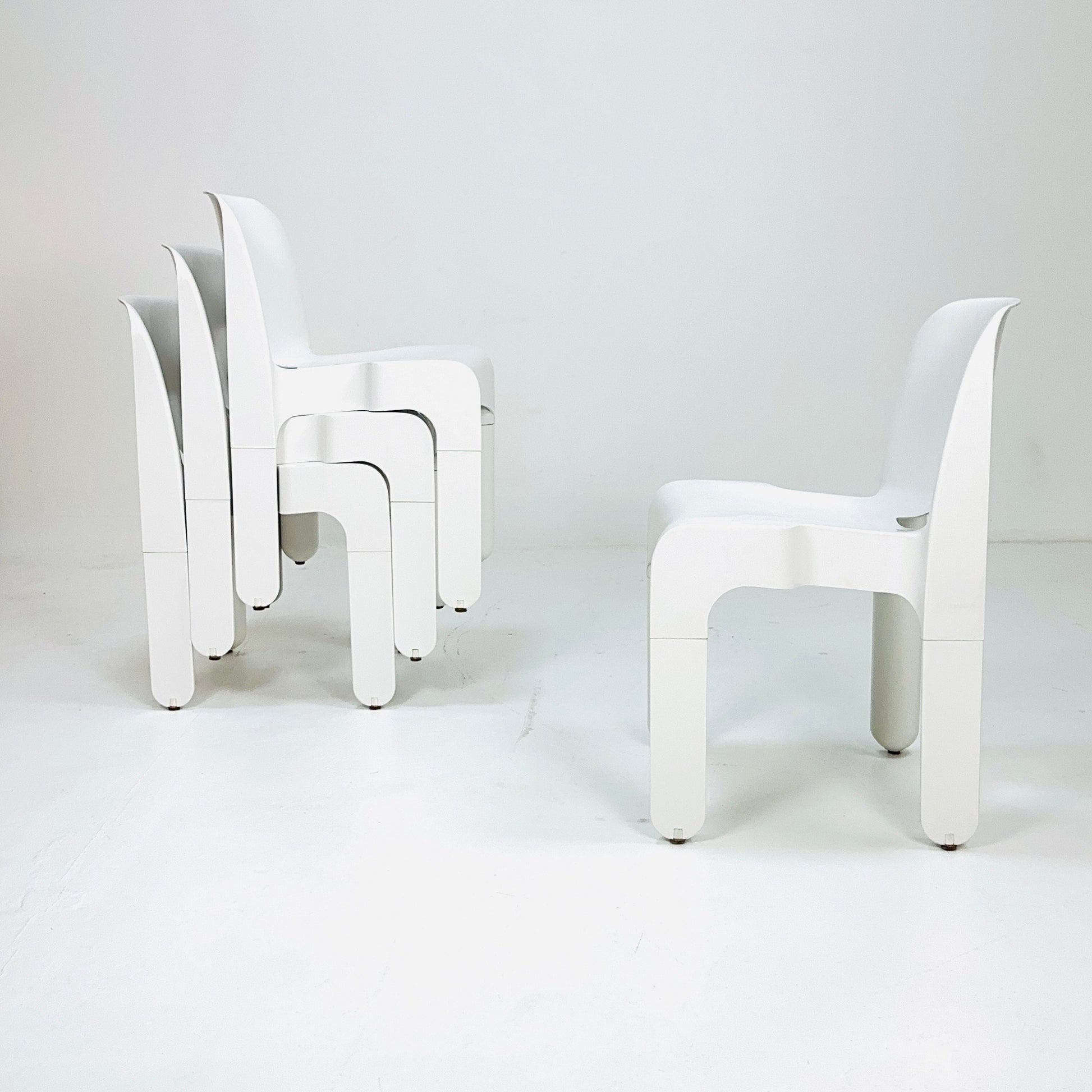 Set of 4 Space age Universale white chairs,designed by Joe Colombo for Kartell Italy 1960s