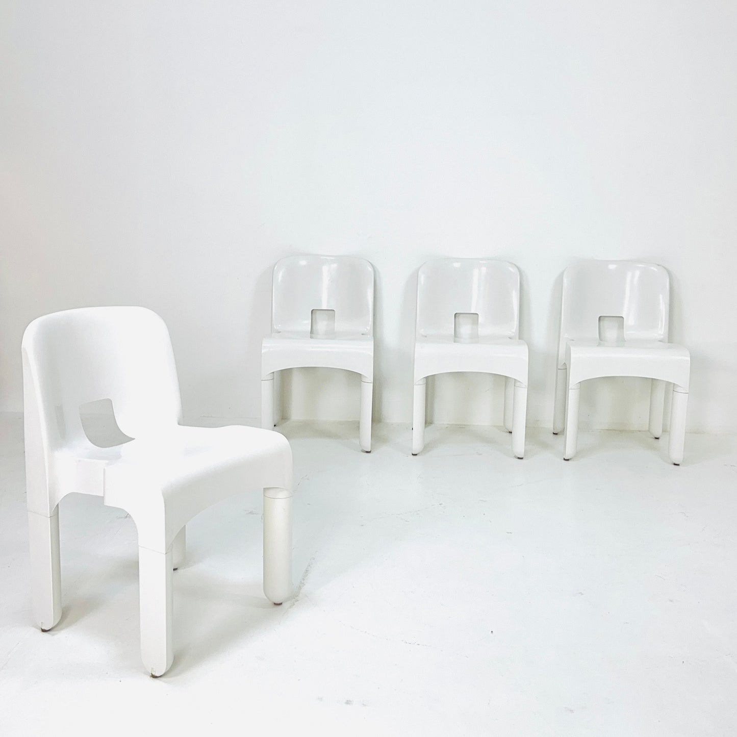 Set of 4 Space age Universale white chairs,designed by Joe Colombo for Kartell Italy 1960s