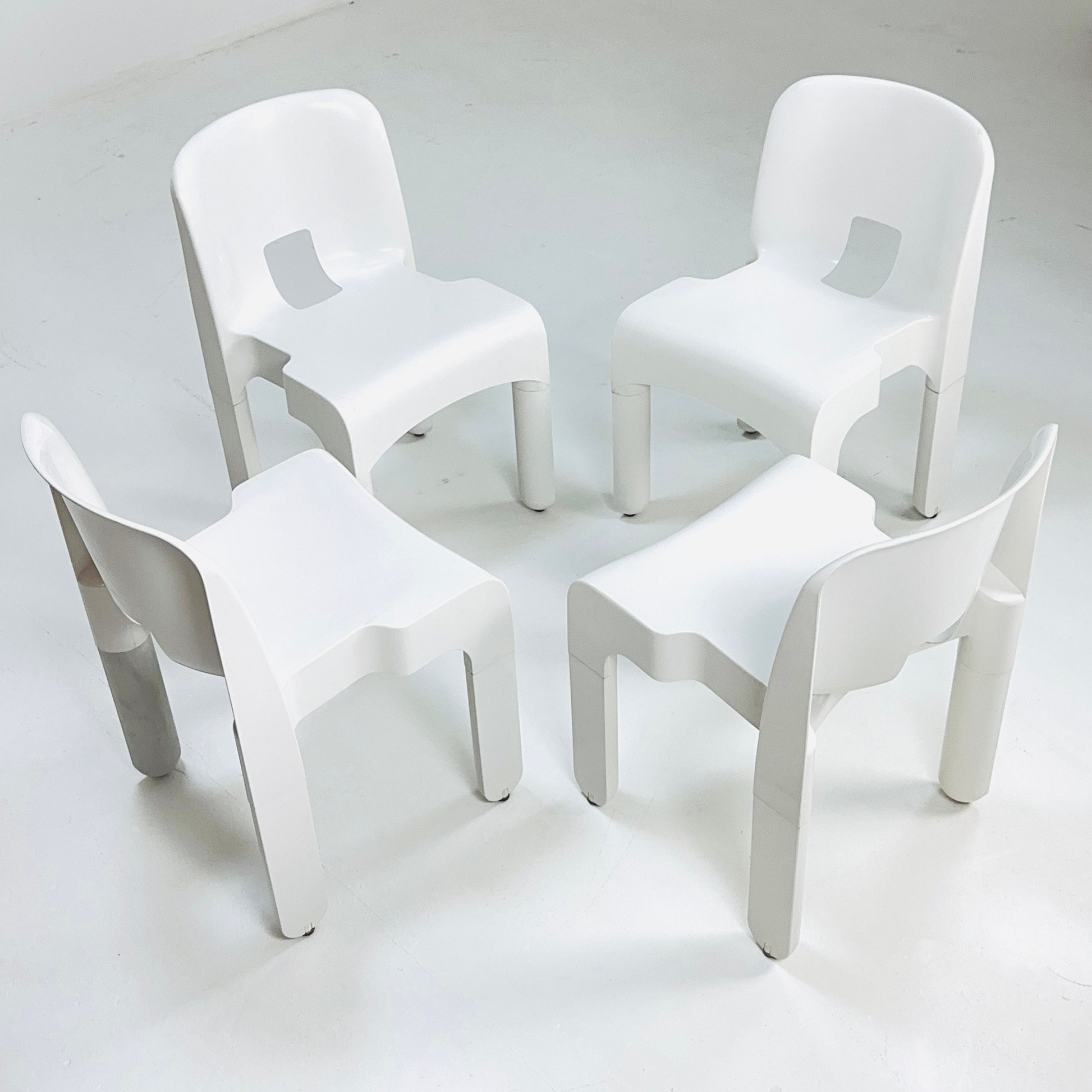 Set of 4 Space age Universale white chairs,designed by Joe Colombo for Kartell Italy 1960s