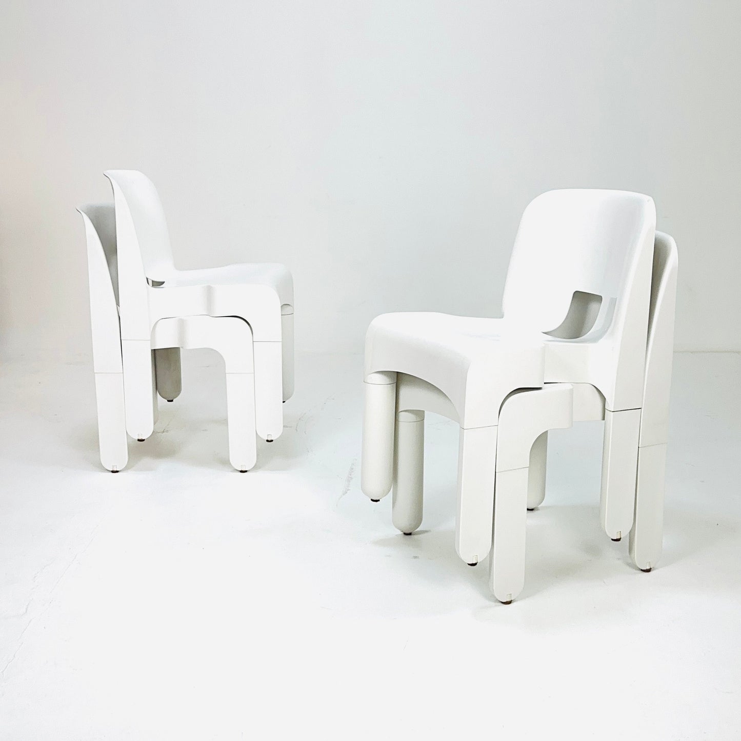 Set of 4 Space age Universale white chairs,designed by Joe Colombo for Kartell Italy 1960s