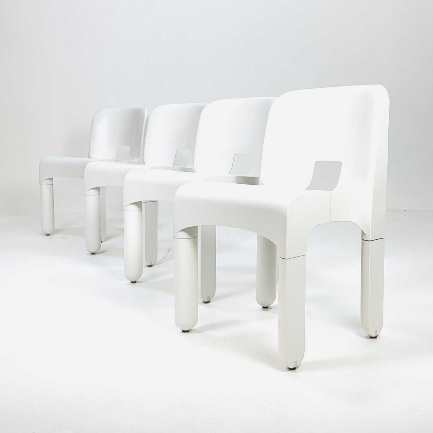 Set of 4 Space age Universale white chairs,designed by Joe Colombo for Kartell Italy 1960s