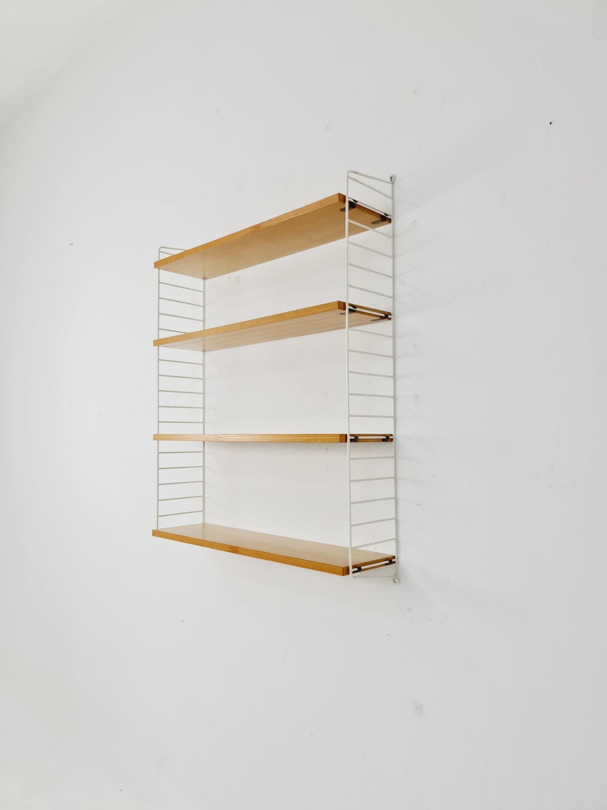 Original MCM Ash shelving system - consists of Black lacquered metal ladders, from string Stockholm 1960s