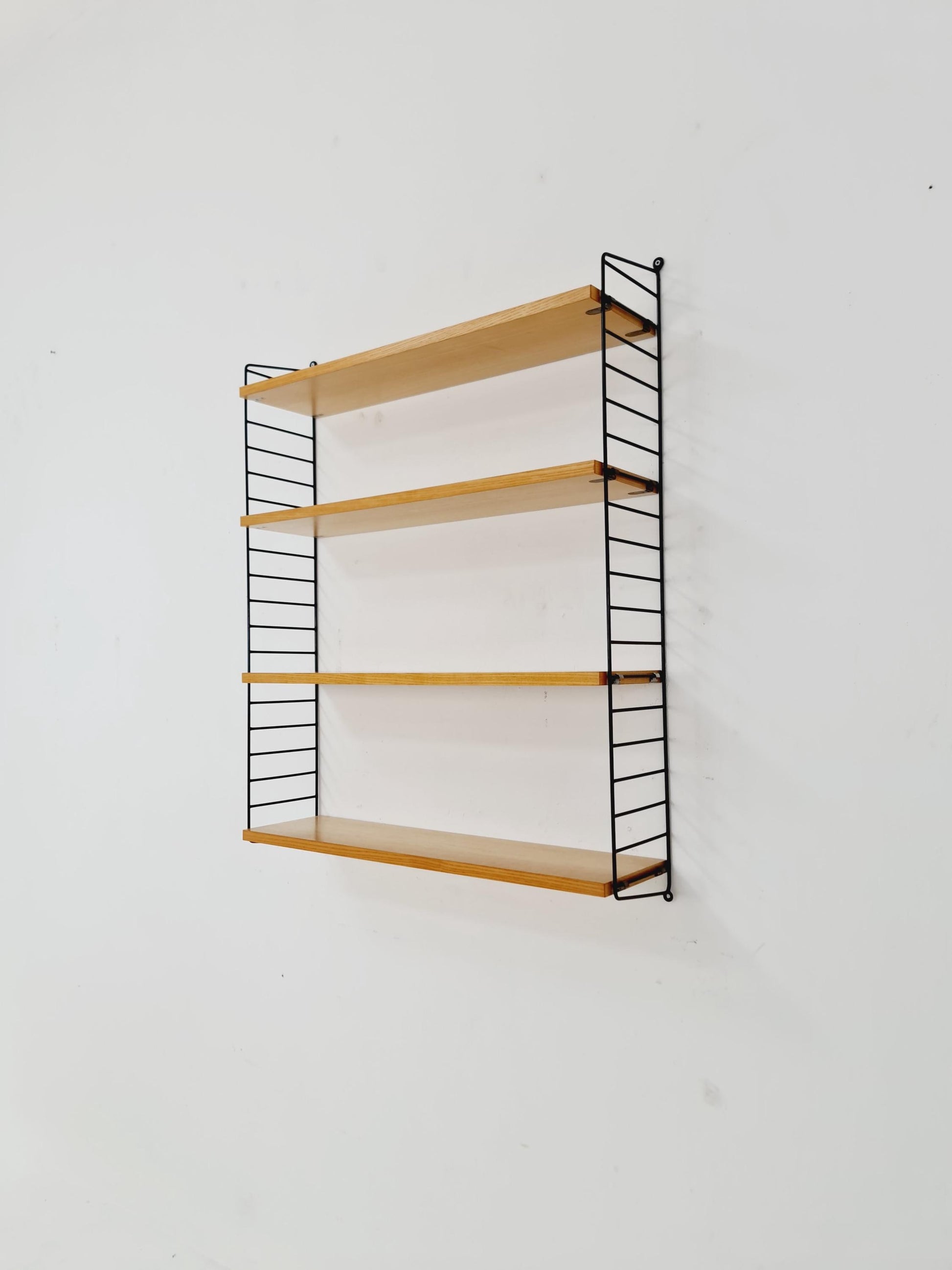 Original MCM Ash shelving system - consists of Black lacquered metal ladders, from string Stockholm 1960s