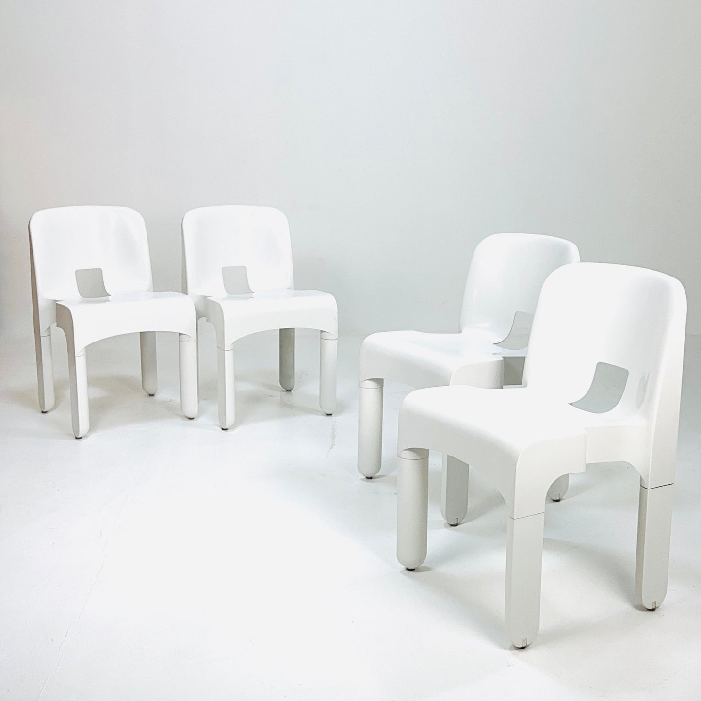 Set of 4 Space age Universale white chairs,designed by Joe Colombo for Kartell Italy 1960s