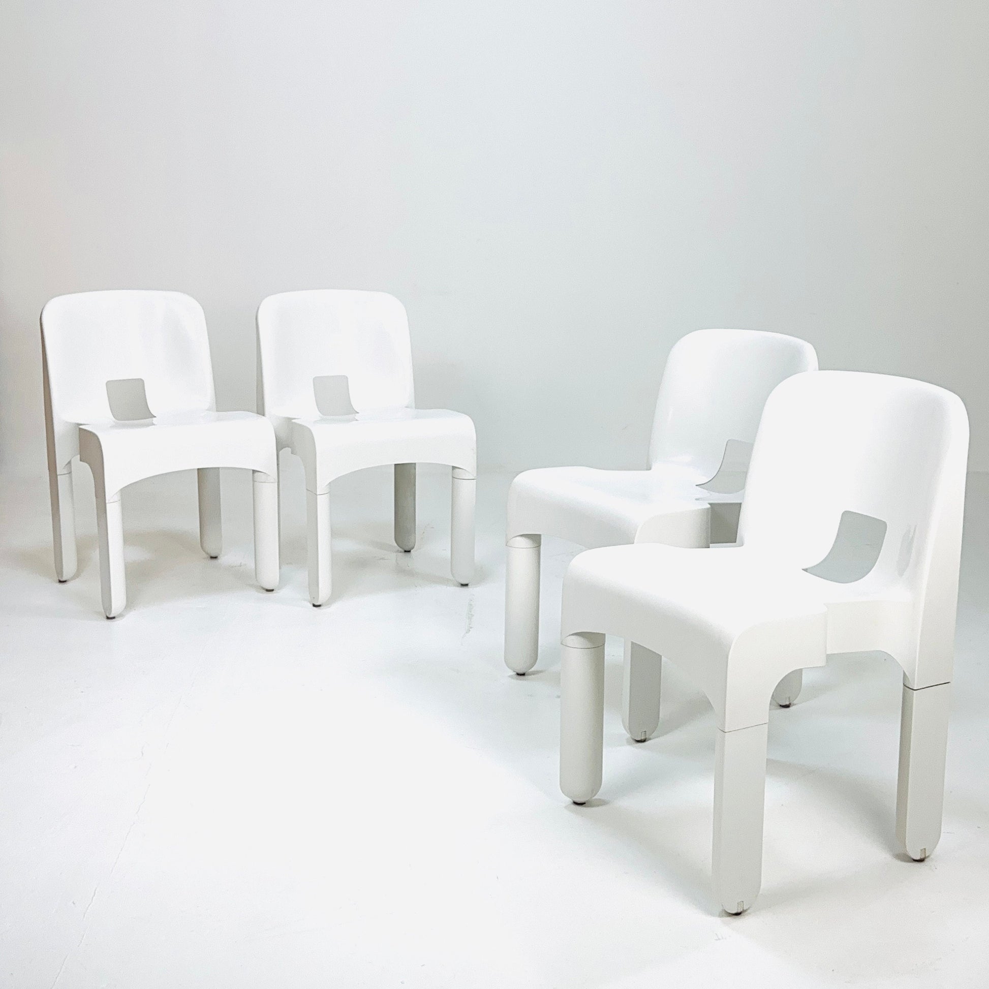 Set of 4 Space age Universale white chairs,designed by Joe Colombo for Kartell Italy 1960s