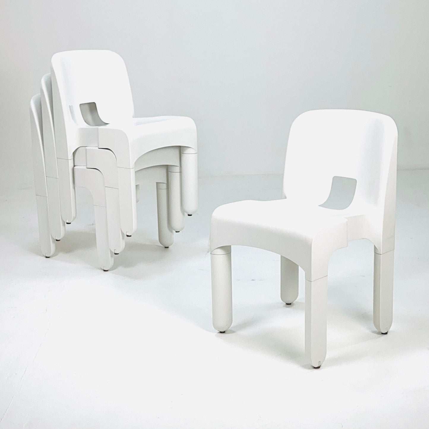 Set of 4 Space age Universale white chairs,designed by Joe Colombo for Kartell Italy 1960s