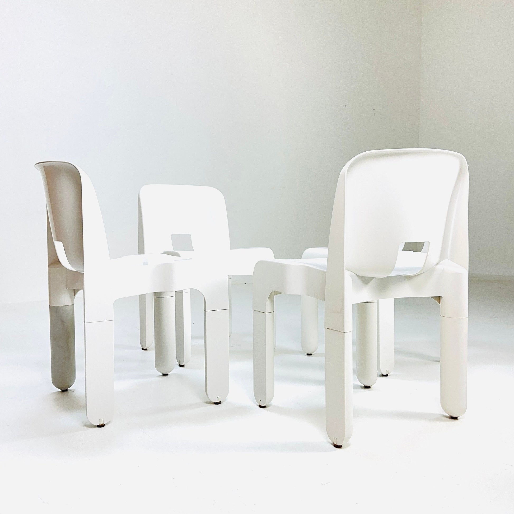 Set of 4 Space age Universale white chairs,designed by Joe Colombo for Kartell Italy 1960s