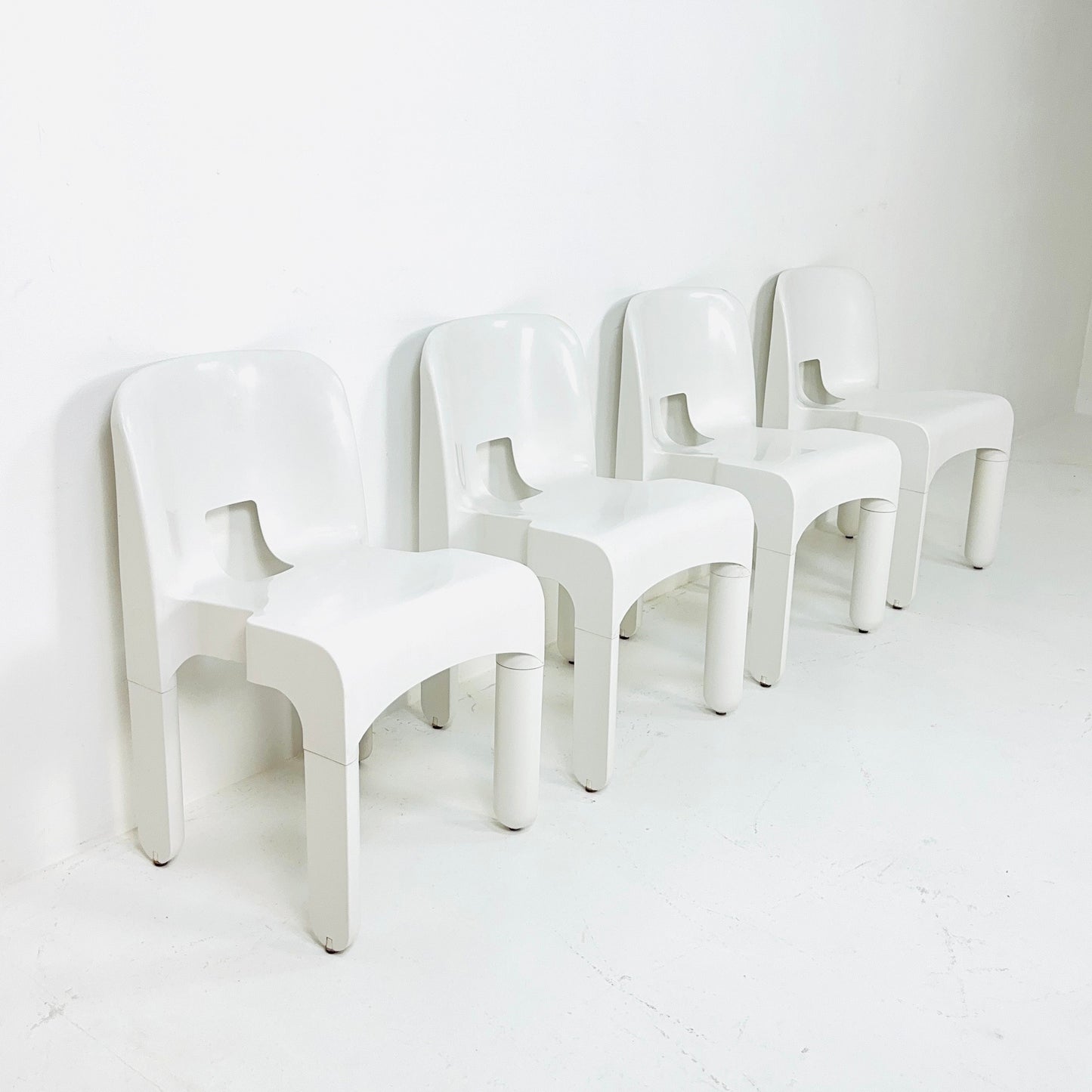 Set of 4 Space age Universale white chairs,designed by Joe Colombo for Kartell Italy 1960s