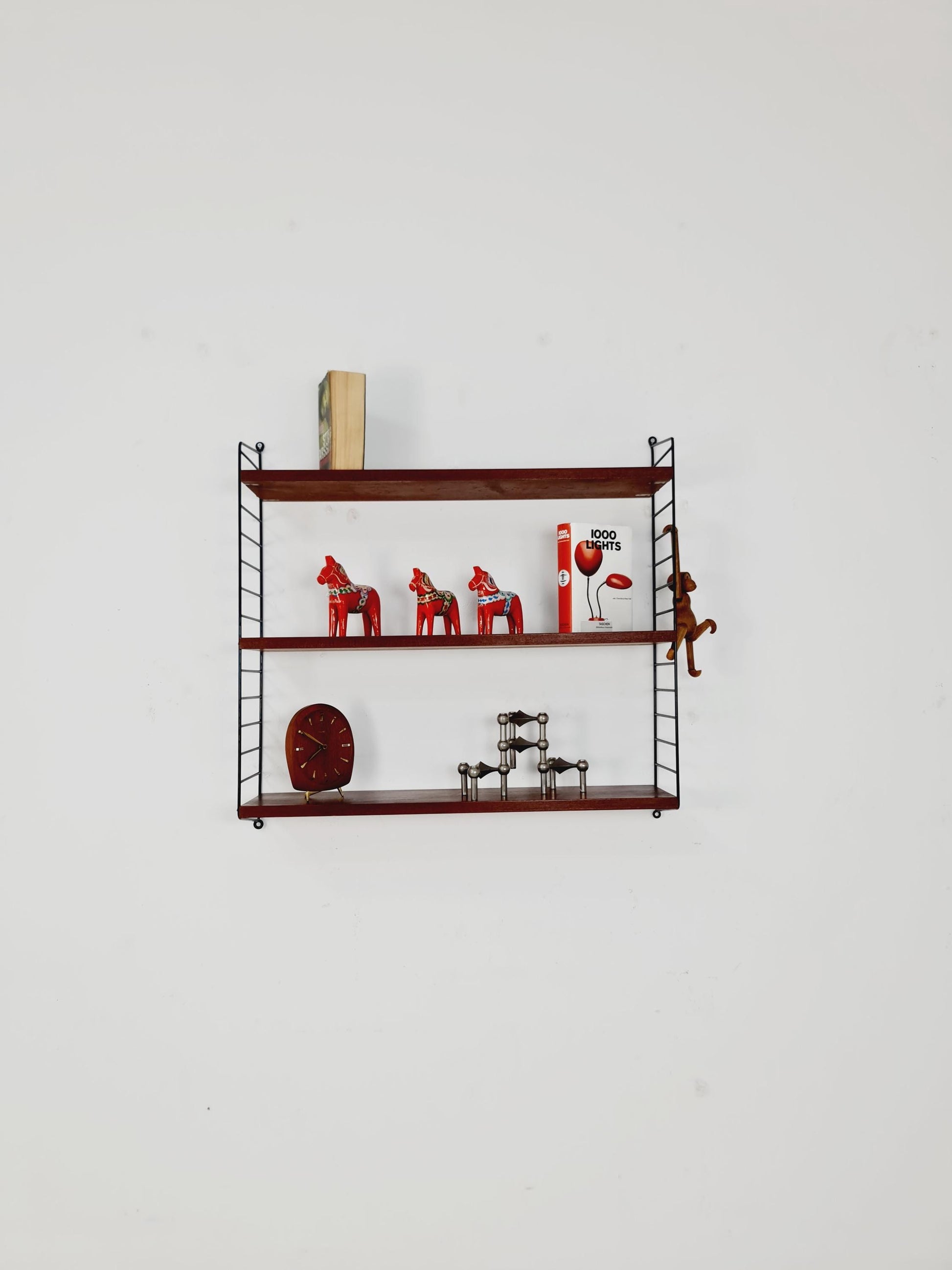 Original MCM Teak shelving system - consists of black lacquered metal ladders, from string Stockholm 1960s