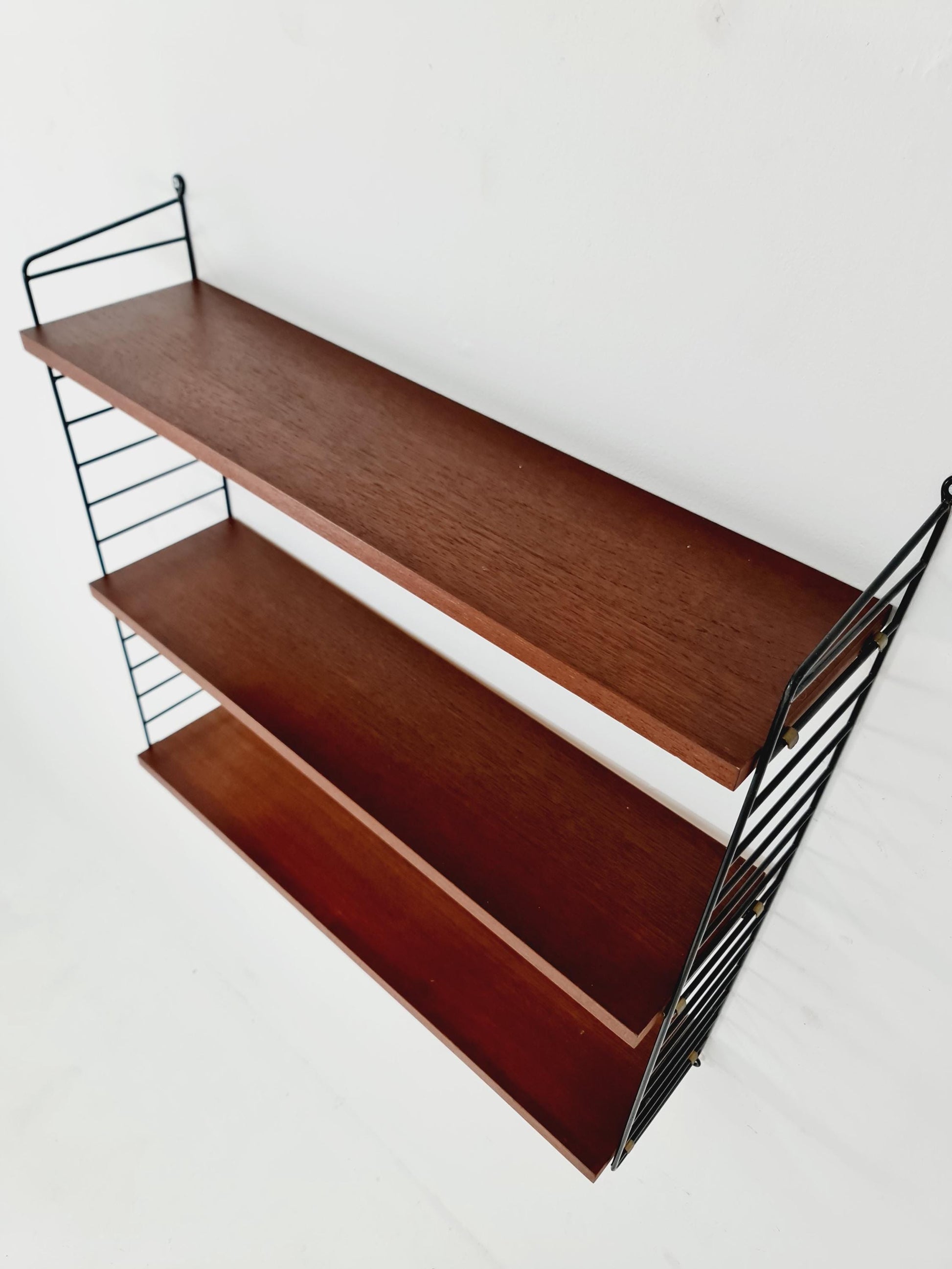 Original MCM Teak shelving system - consists of black lacquered metal ladders, from string Stockholm 1960s