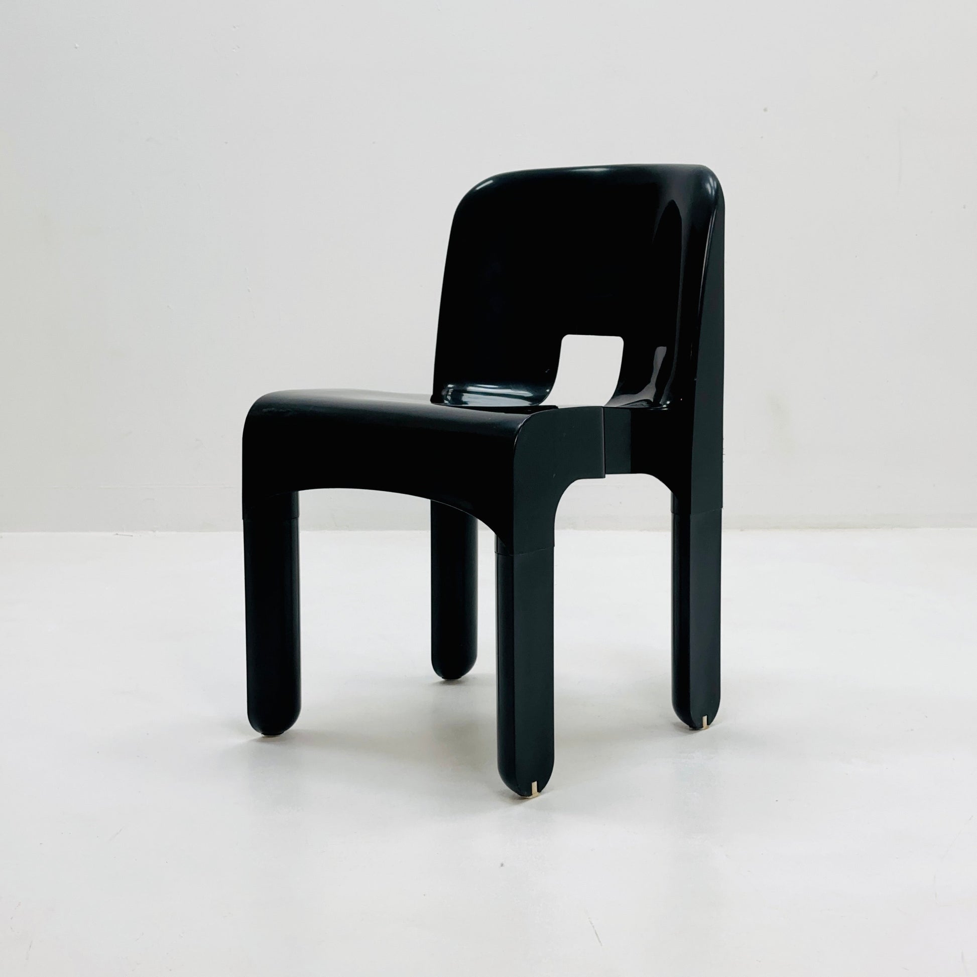 Space age Universale plastic black chair model 4867 ,designed by Joe Colombo for Kartell Italy. 1970s