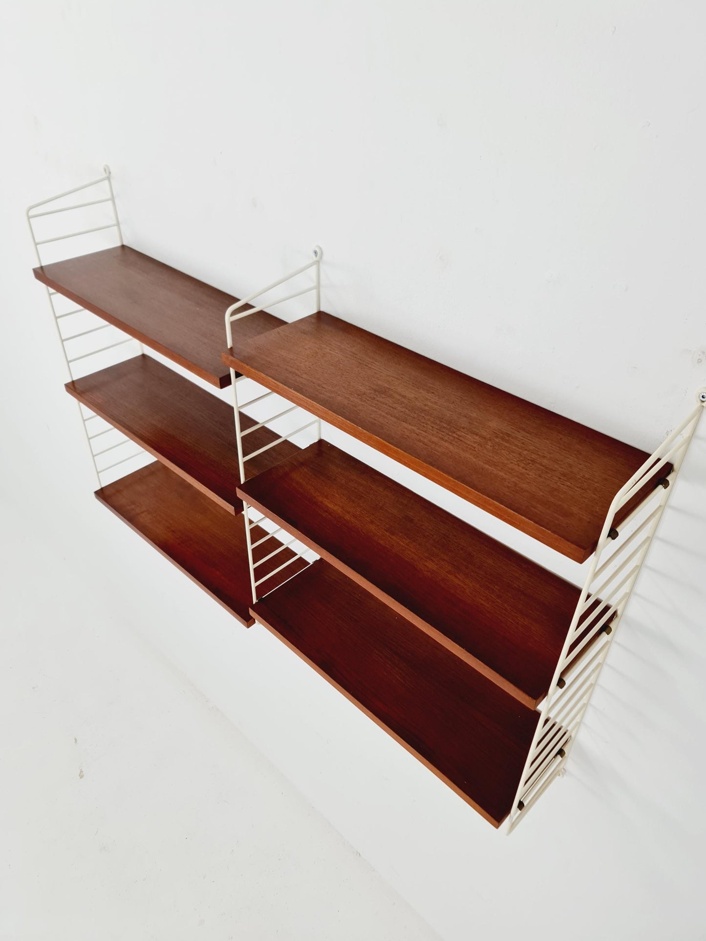 Original MCM Teak shelving system - consists of white lacquered metal ladders, from string Stockholm 1960s