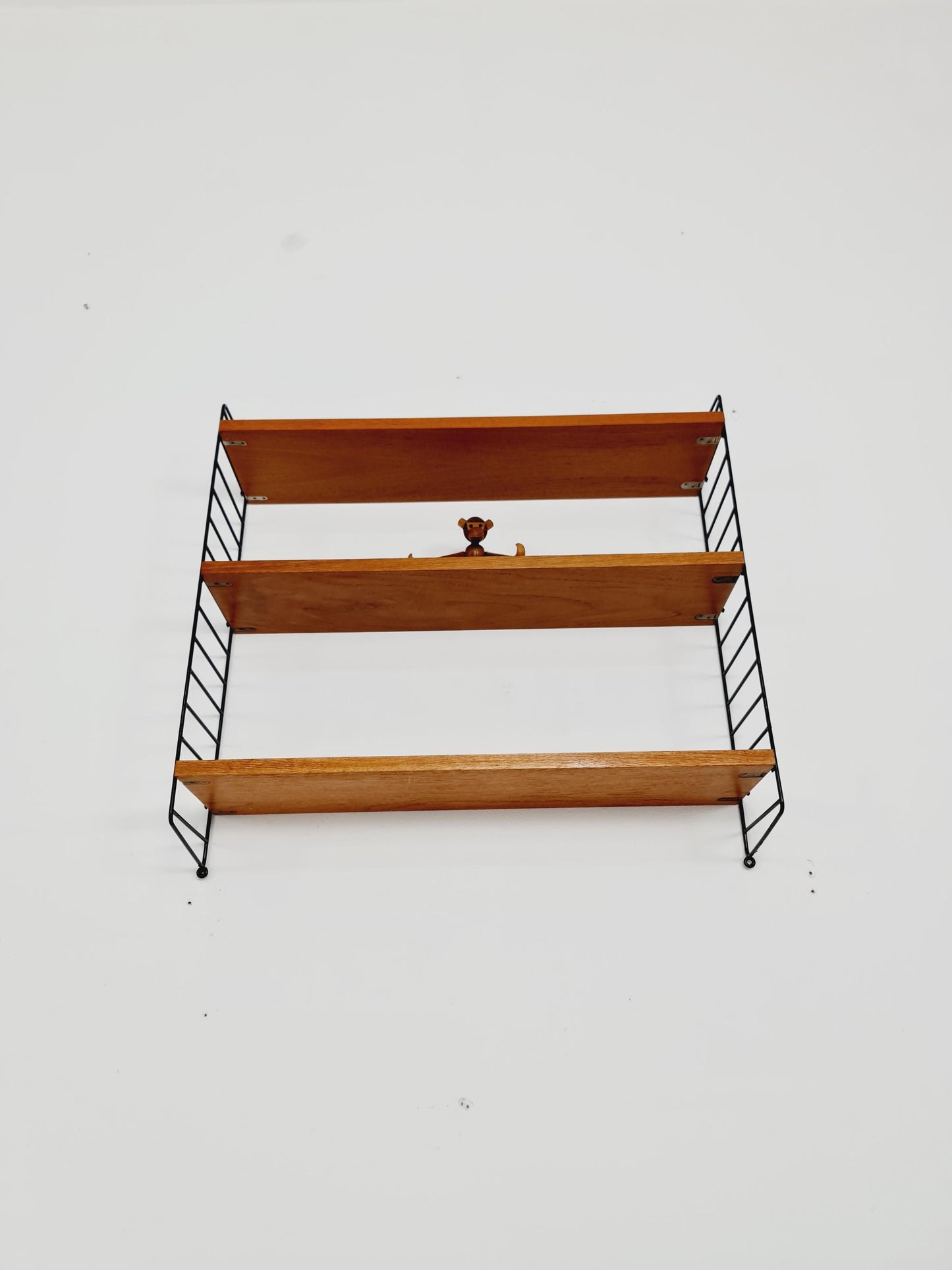 Original MCM Teak shelving system - consists of black lacquered metal ladders, from string Stockholm 1960s