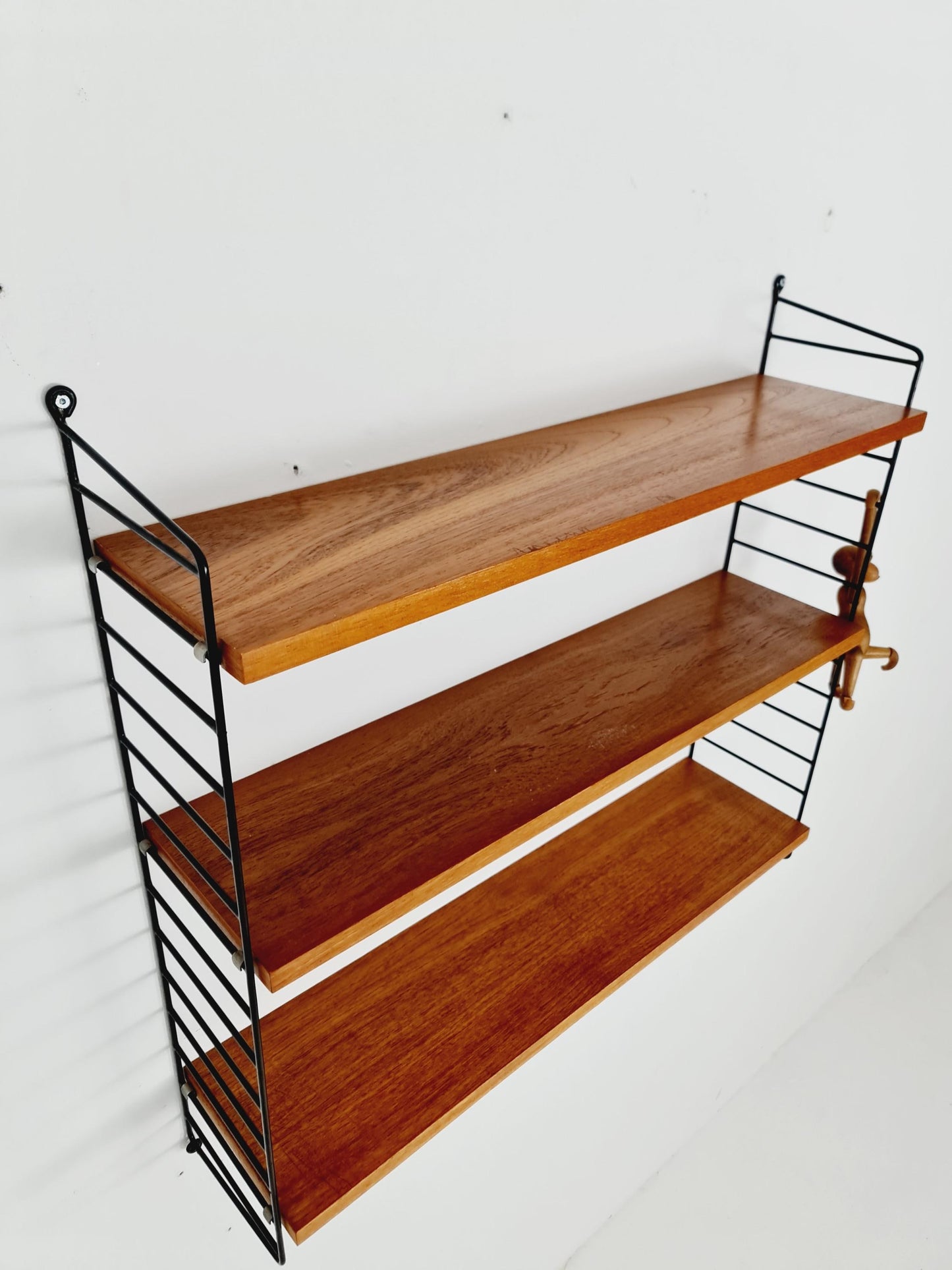 Original MCM Teak shelving system - consists of black lacquered metal ladders, from string Stockholm 1960s