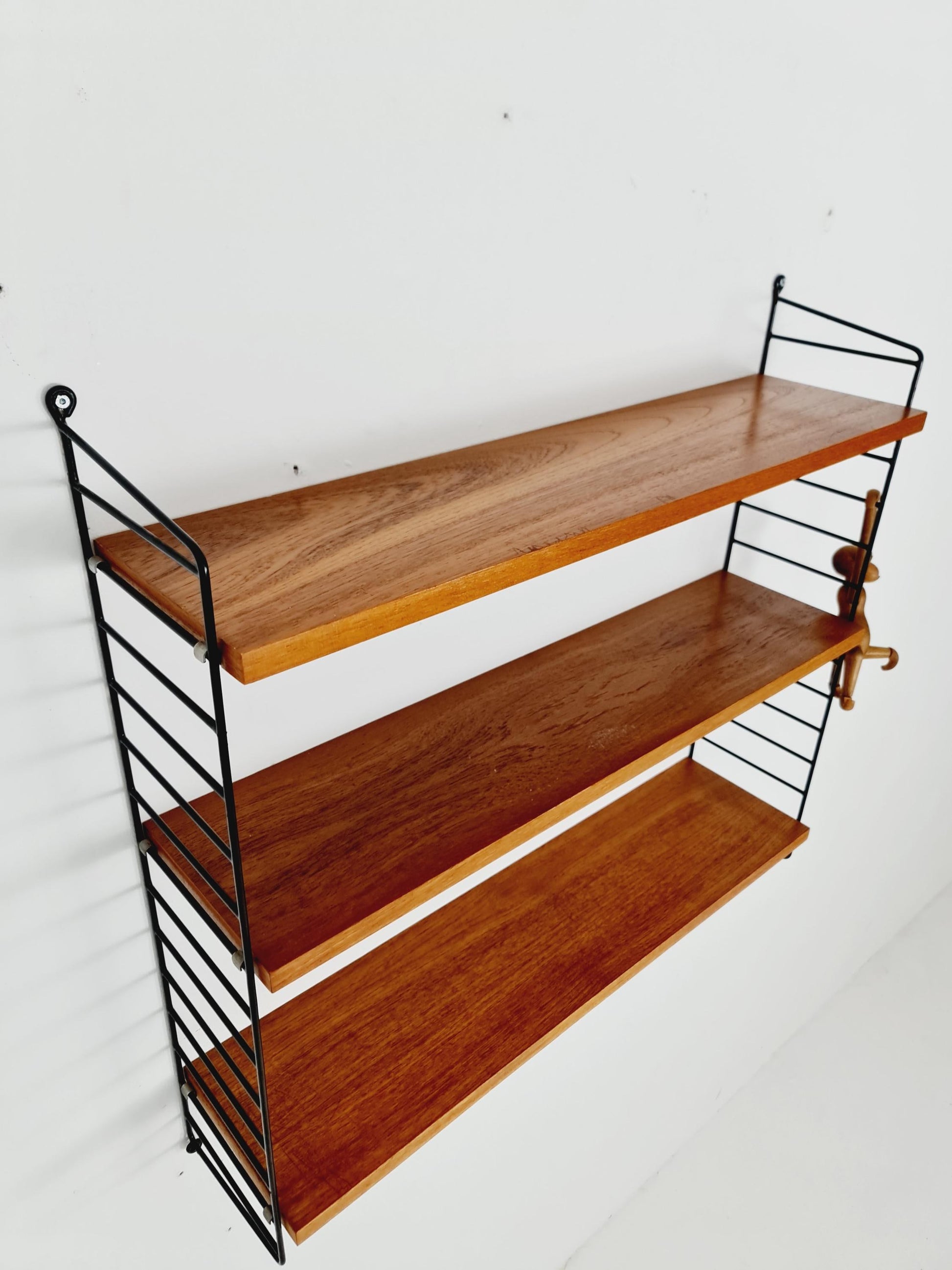 Original MCM Teak shelving system - consists of black lacquered metal ladders, from string Stockholm 1960s