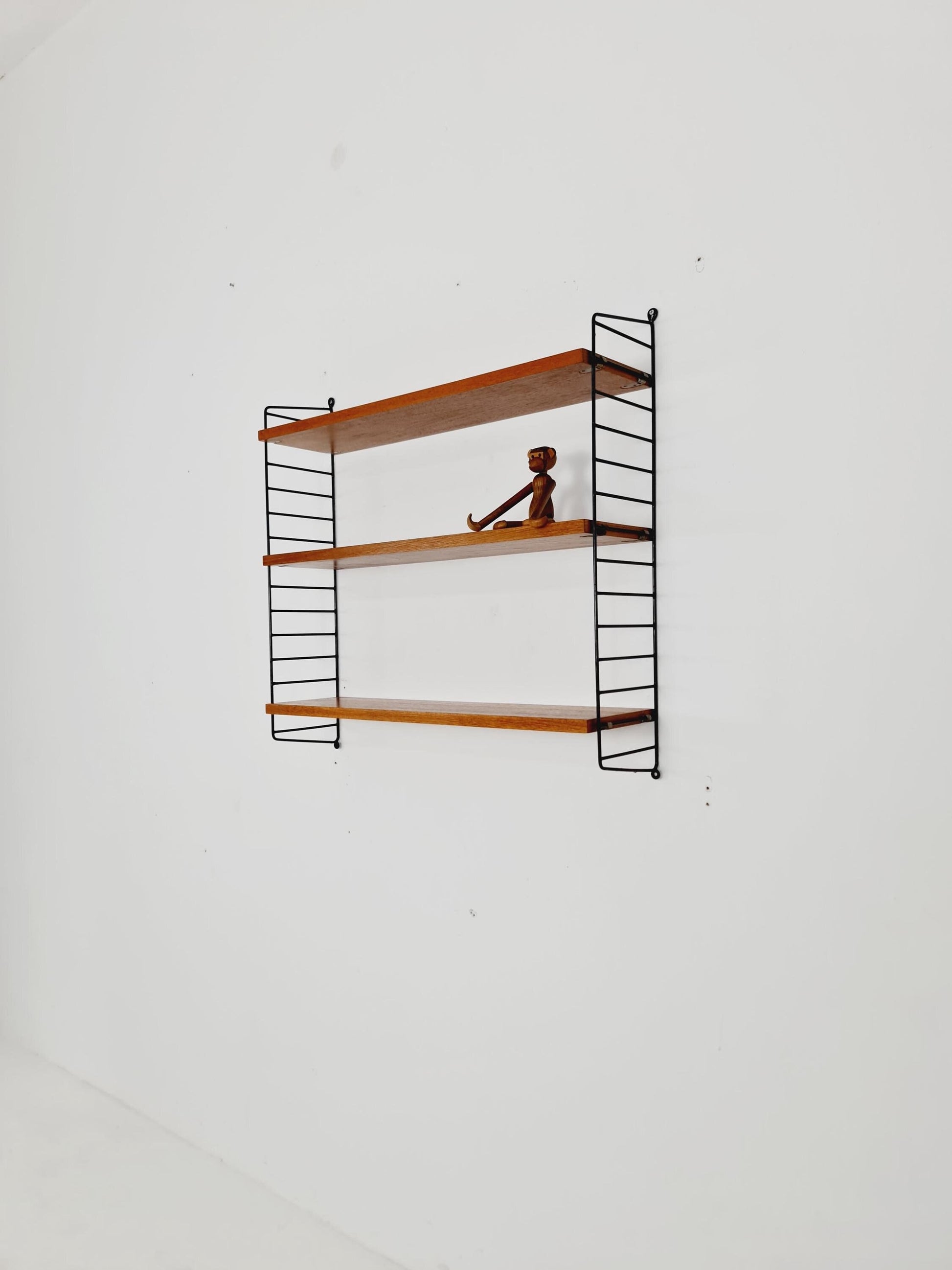 Original MCM Teak shelving system - consists of black lacquered metal ladders, from string Stockholm 1960s
