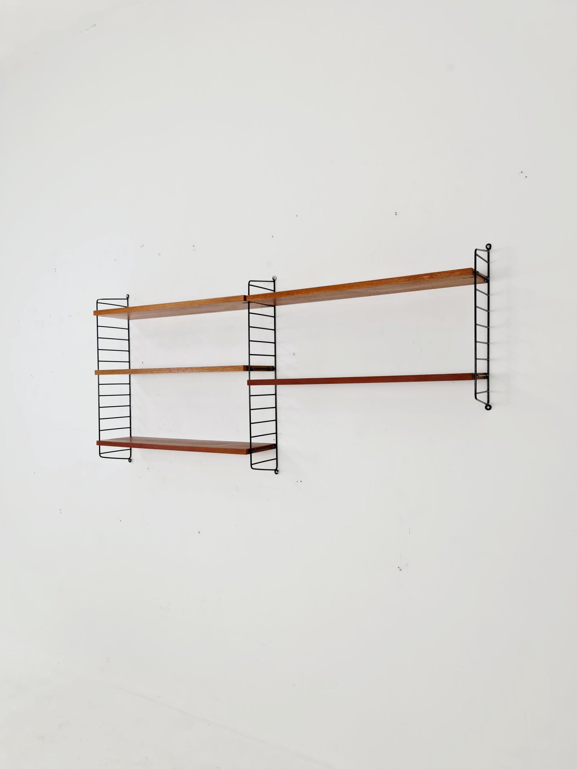 Original MCM Teak shelving system - consists of black lacquered metal ladders, from string Stockholm 1960s