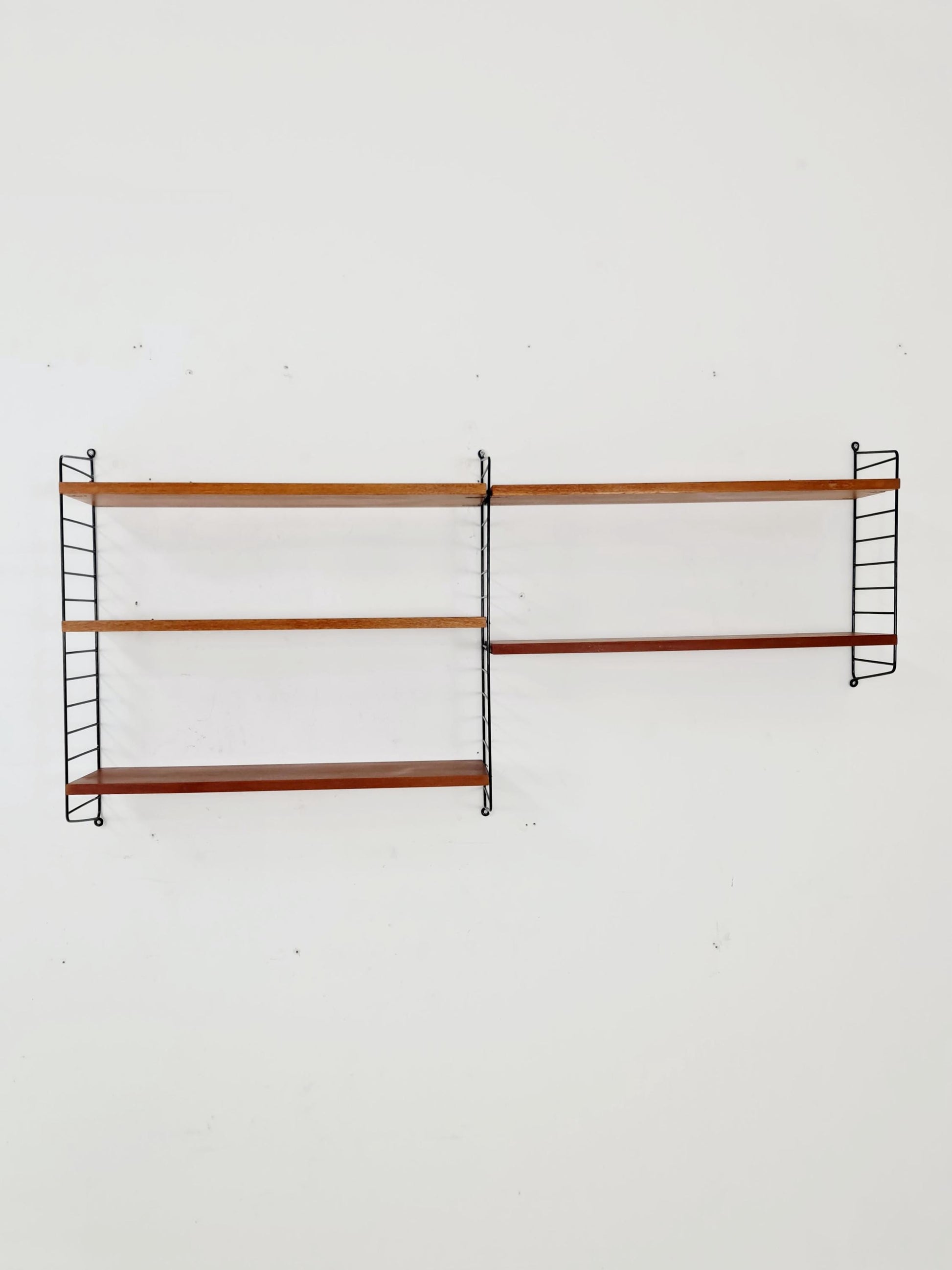 Original MCM Teak shelving system - consists of black lacquered metal ladders, from string Stockholm 1960s