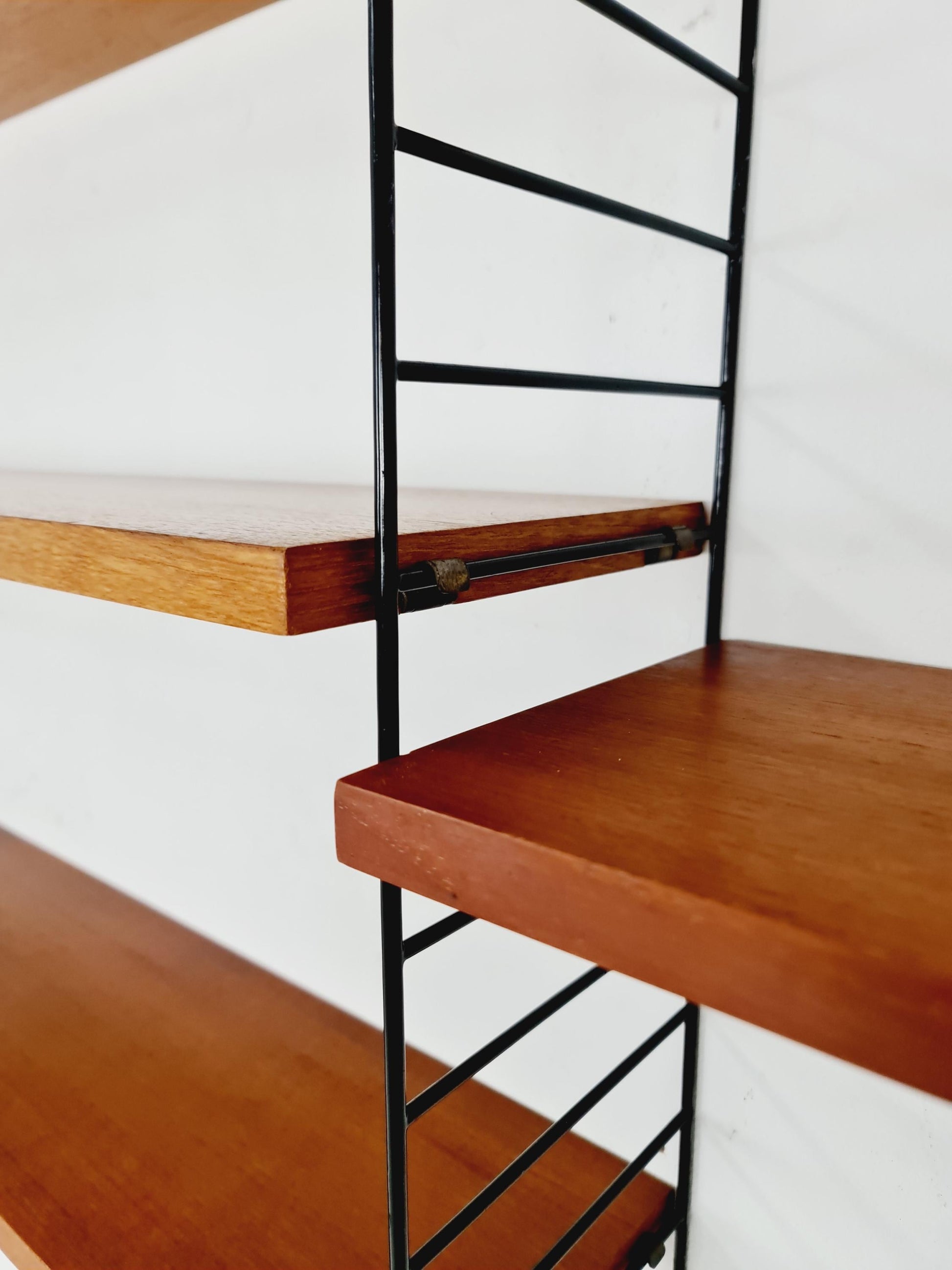 Original MCM Teak shelving system - consists of black lacquered metal ladders, from string Stockholm 1960s