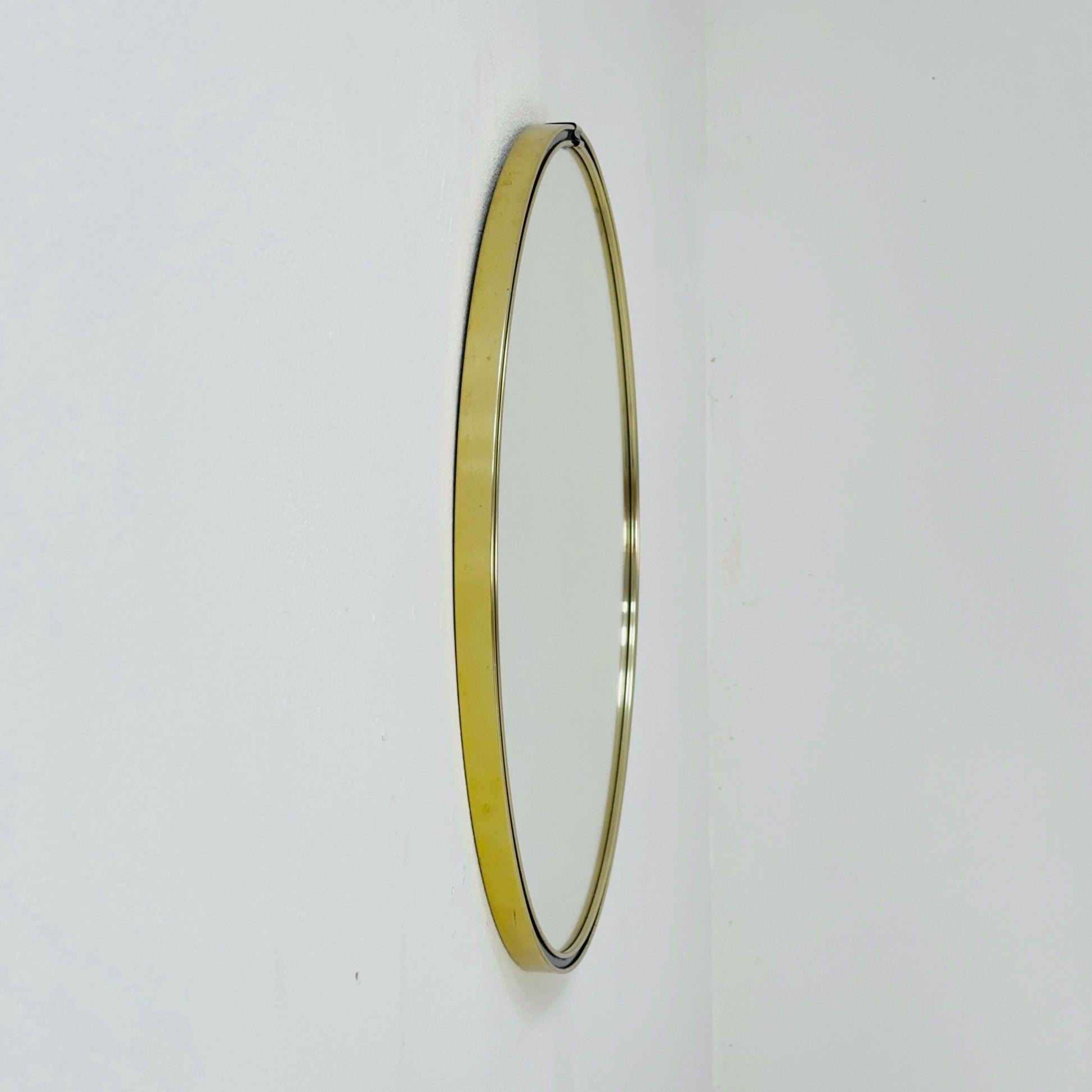 Mid century circle -shaped mirror with golden metal frame- 1960s