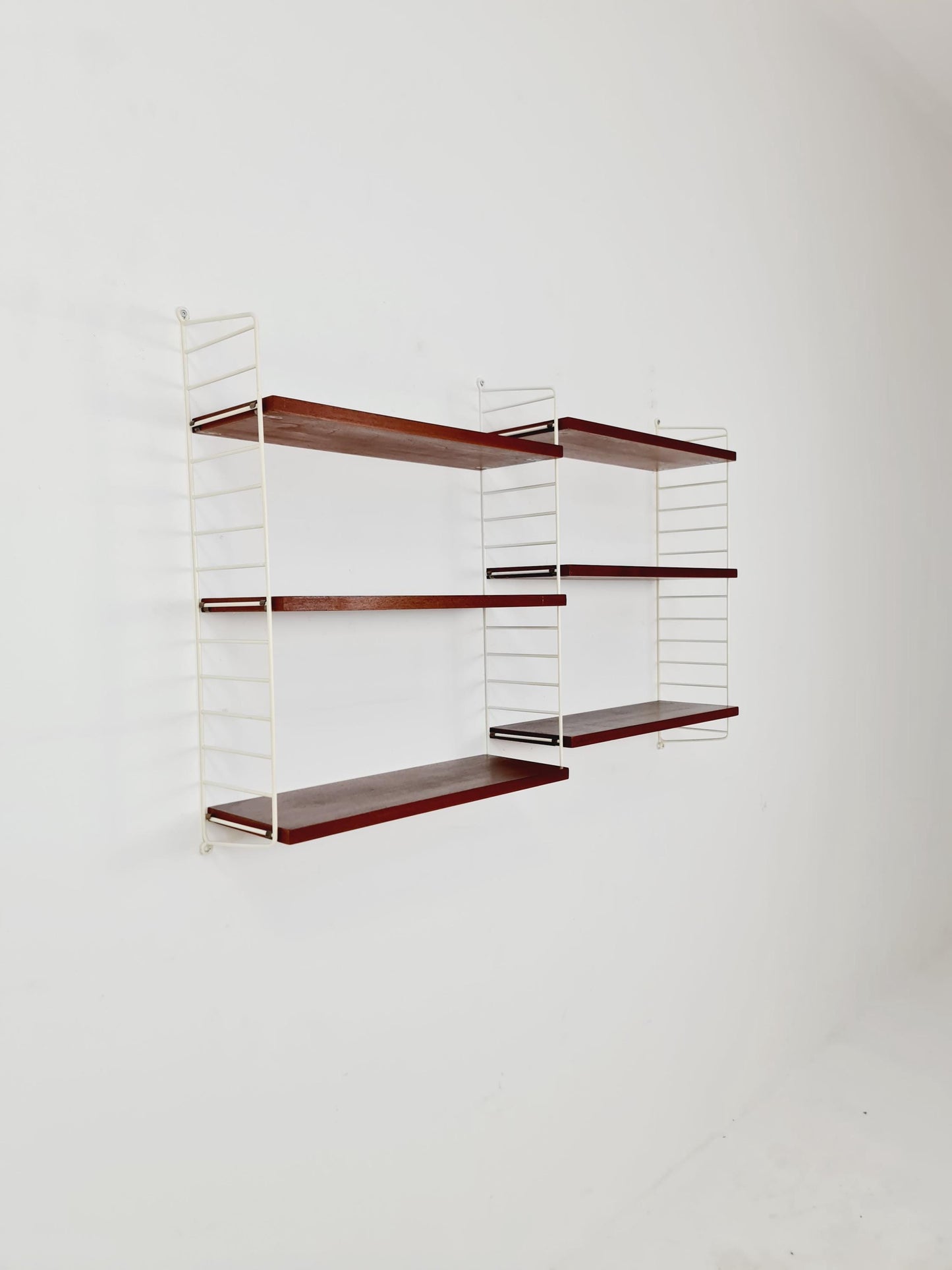 Original MCM Teak shelving system - consists of white lacquered metal ladders, from string Stockholm 1960s