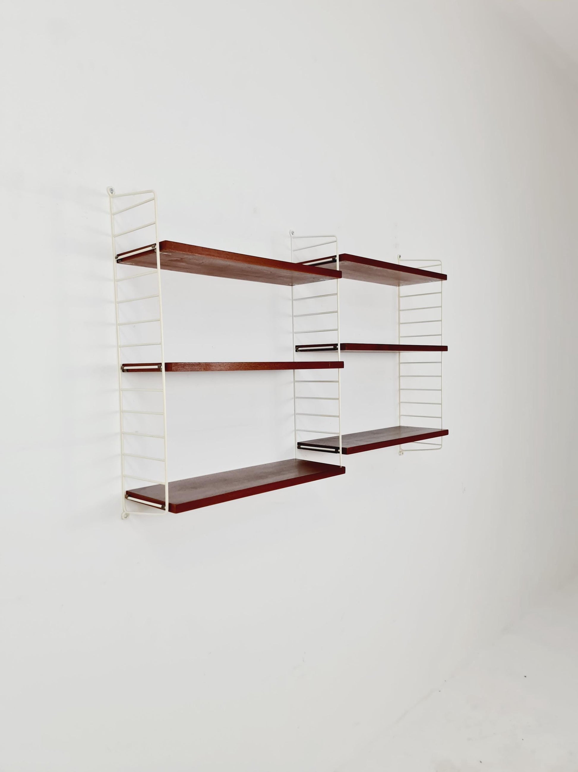 Original MCM Teak shelving system - consists of white lacquered metal ladders, from string Stockholm 1960s