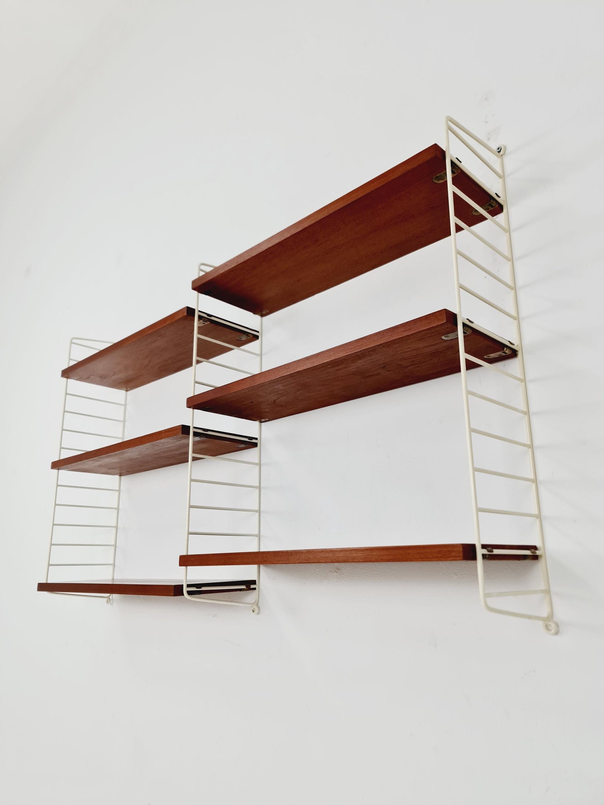 Original MCM Teak shelving system - consists of white lacquered metal ladders, from string Stockholm 1960s