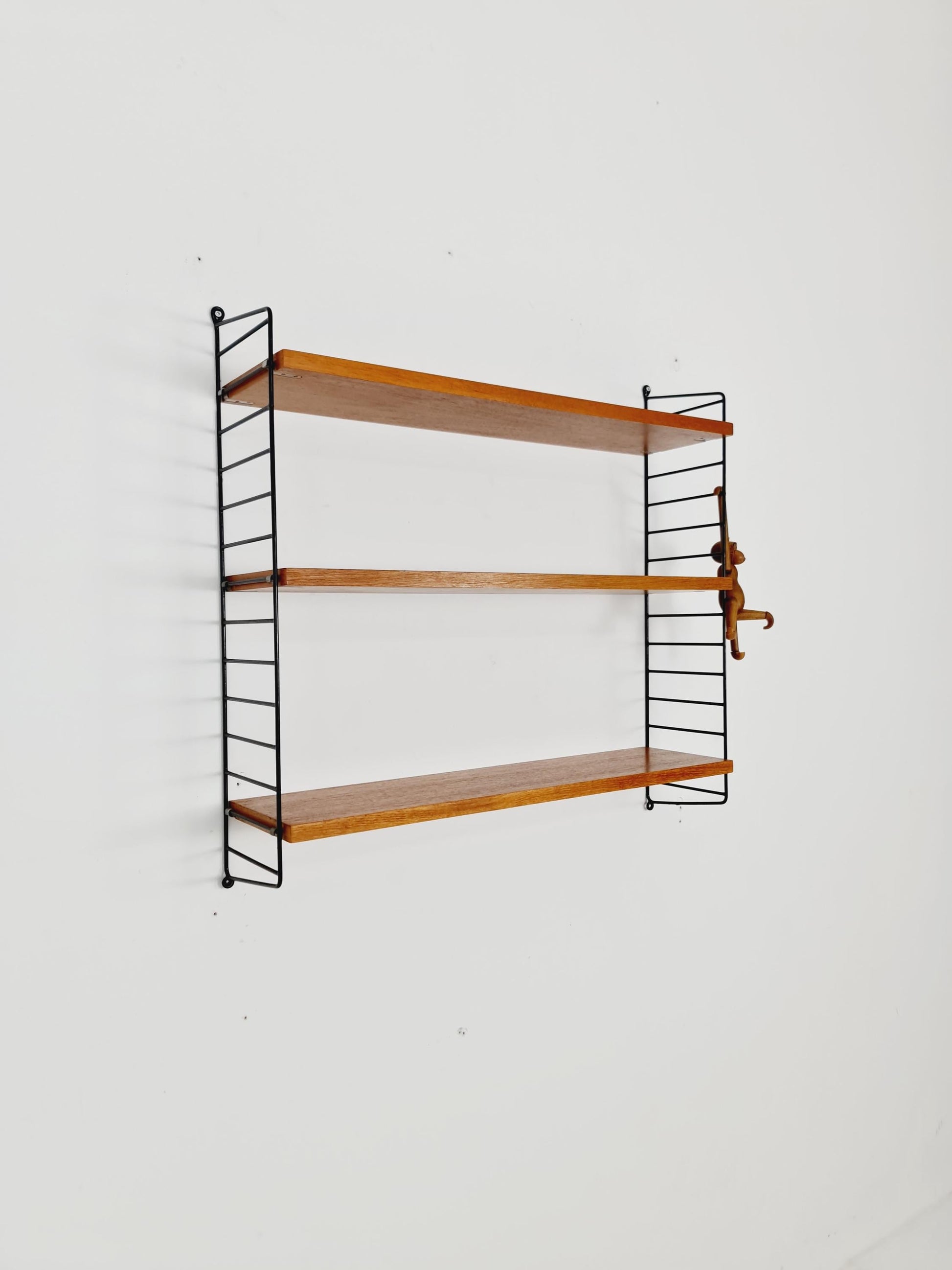 Original MCM Teak shelving system - consists of black lacquered metal ladders, from string Stockholm 1960s