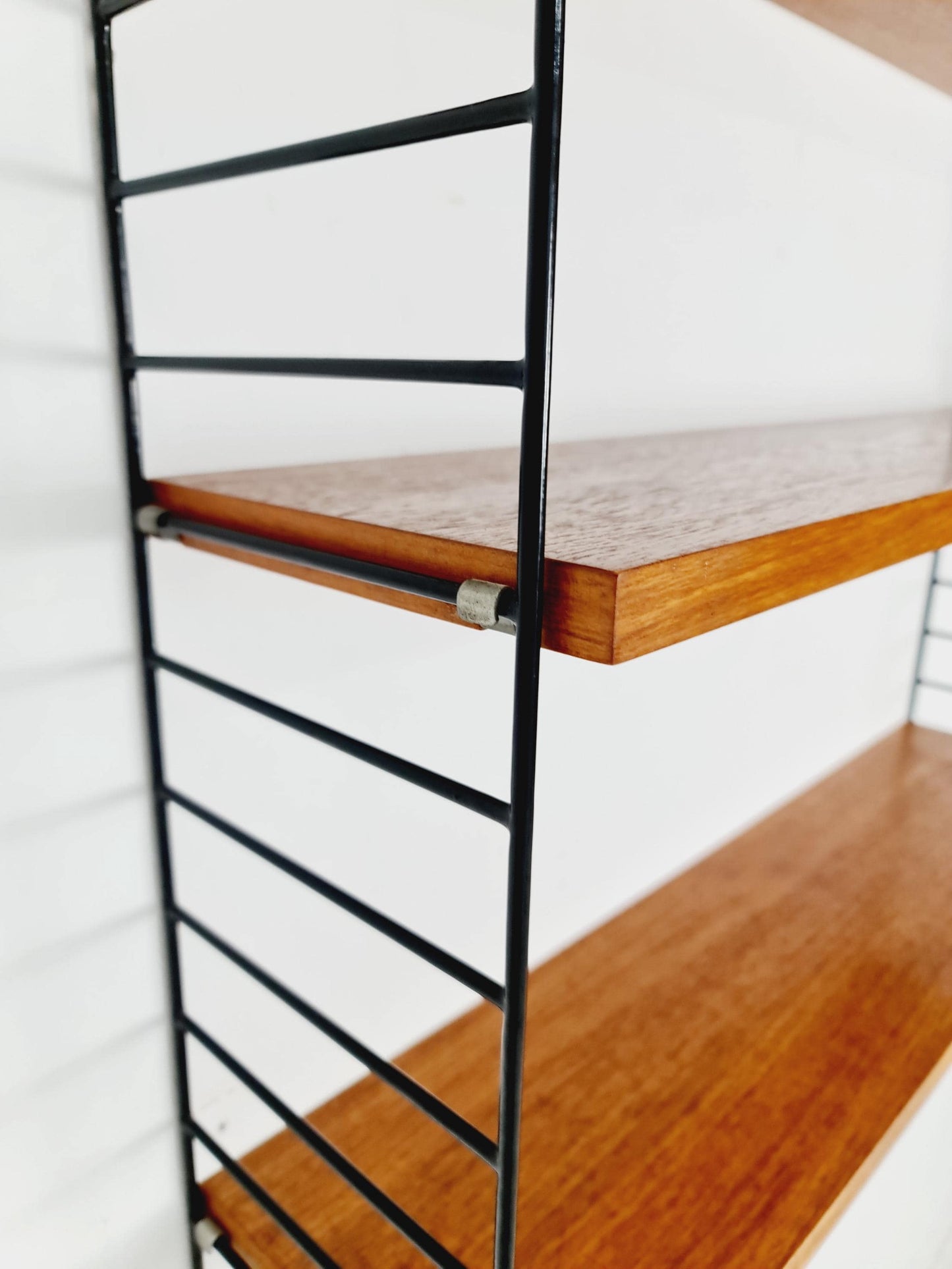 Original MCM Teak shelving system - consists of black lacquered metal ladders, from string Stockholm 1960s