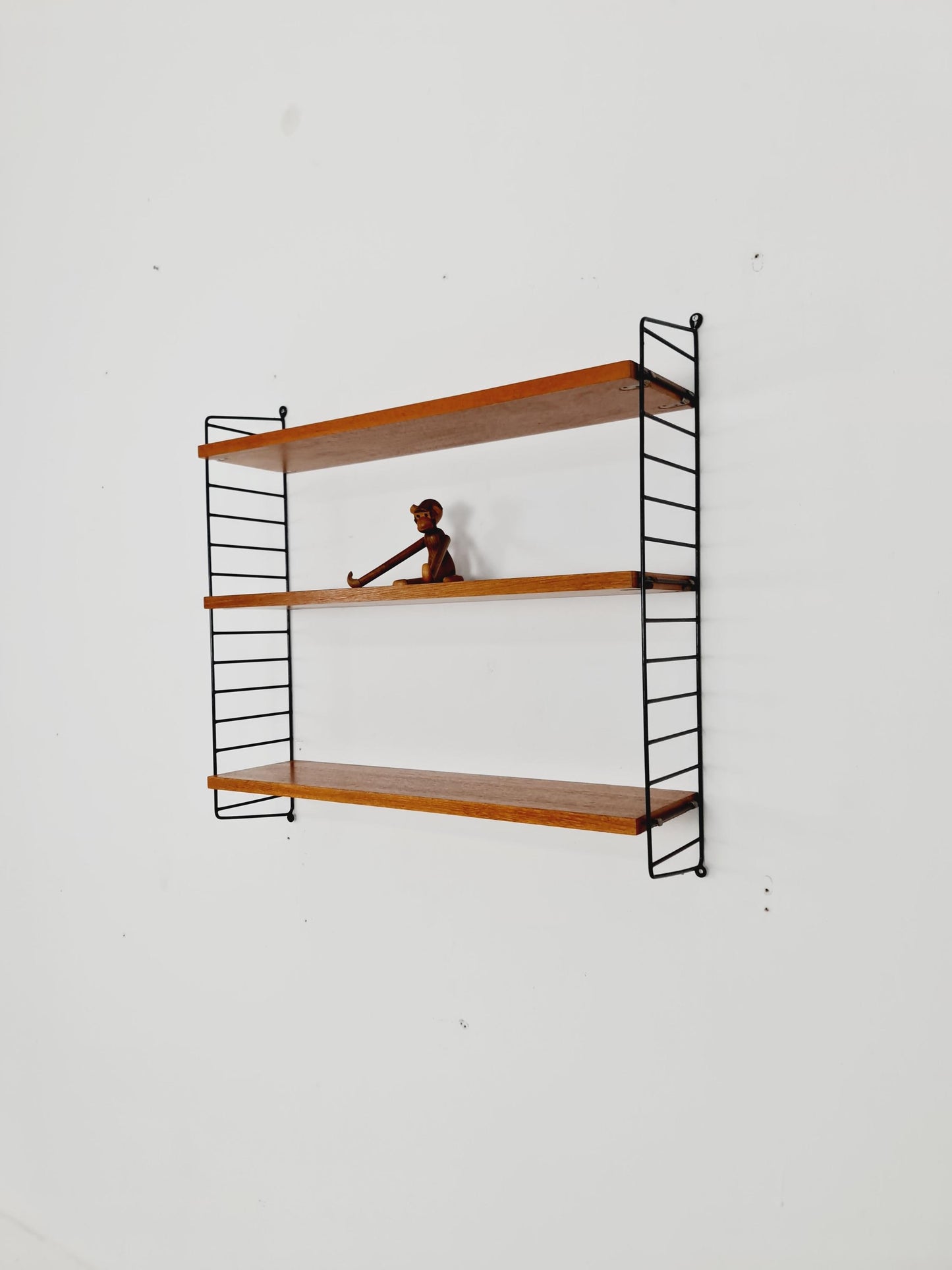 Original MCM Teak shelving system - consists of black lacquered metal ladders, from string Stockholm 1960s