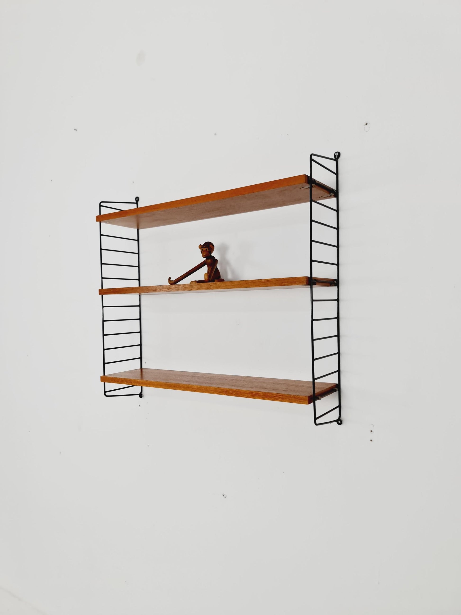 Original MCM Teak shelving system - consists of black lacquered metal ladders, from string Stockholm 1960s