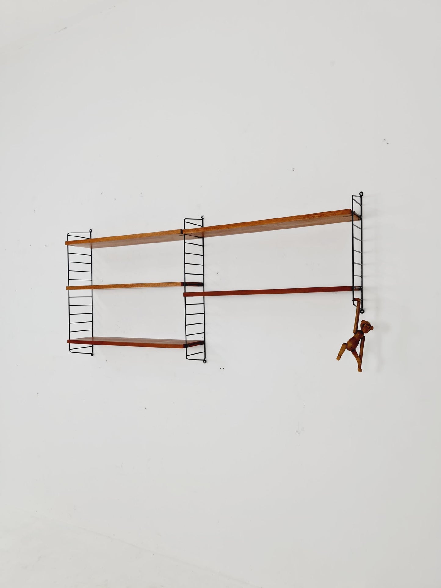 Original MCM Teak shelving system - consists of black lacquered metal ladders, from string Stockholm 1960s