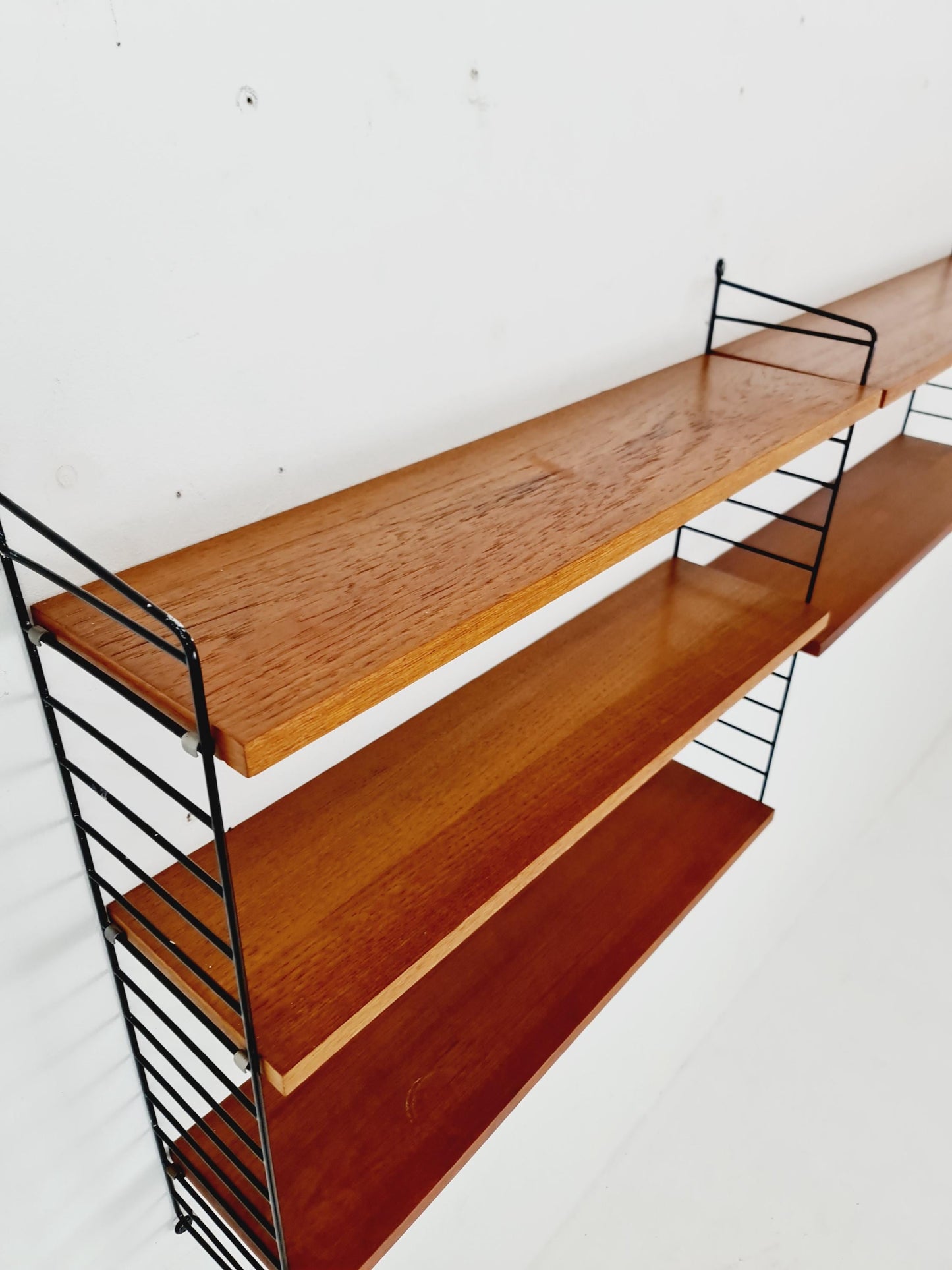 Original MCM Teak shelving system - consists of black lacquered metal ladders, from string Stockholm 1960s